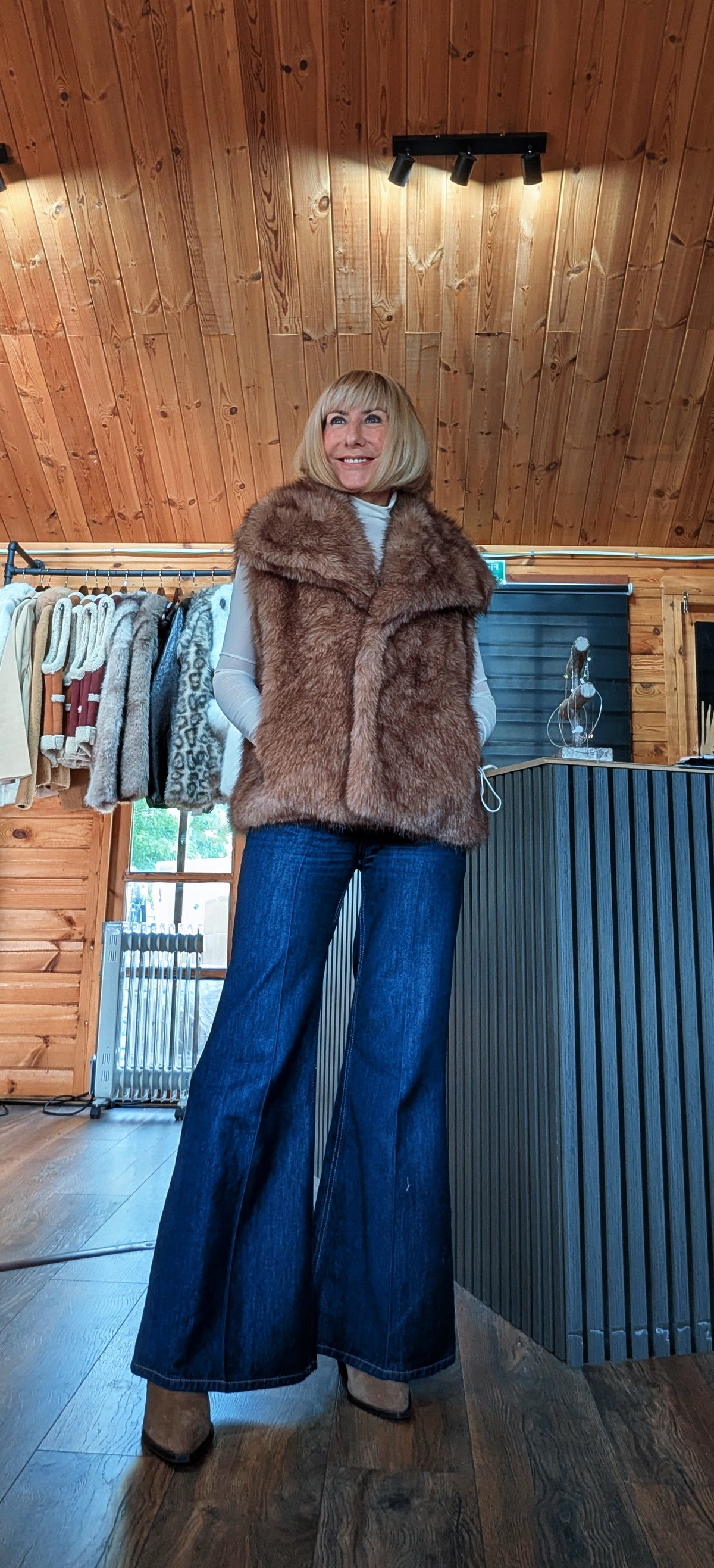 ditsydi  wearing the Coco chocolate faux fur gilet layered over a top