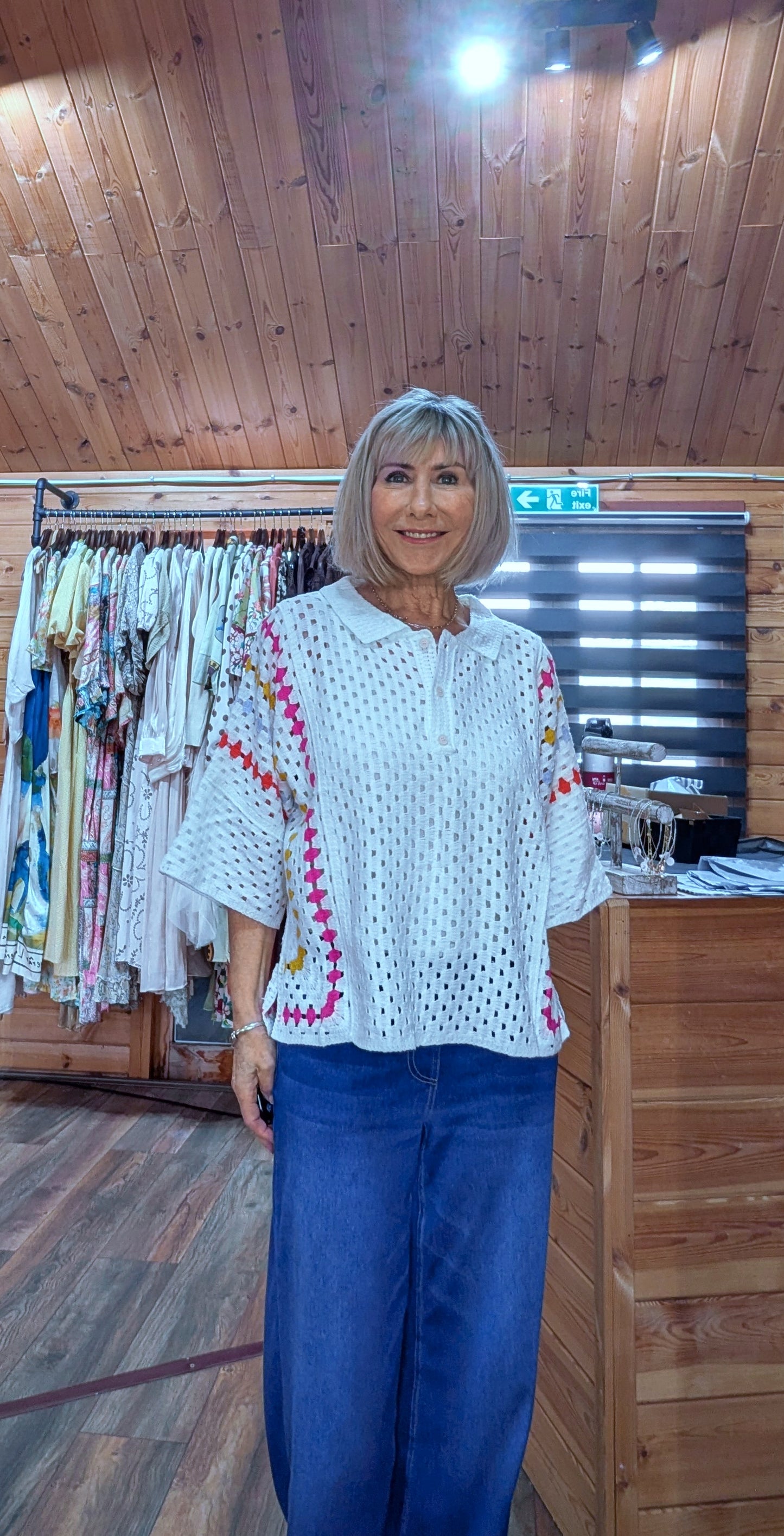 Off white crochet top with pink yellow and light blue trim