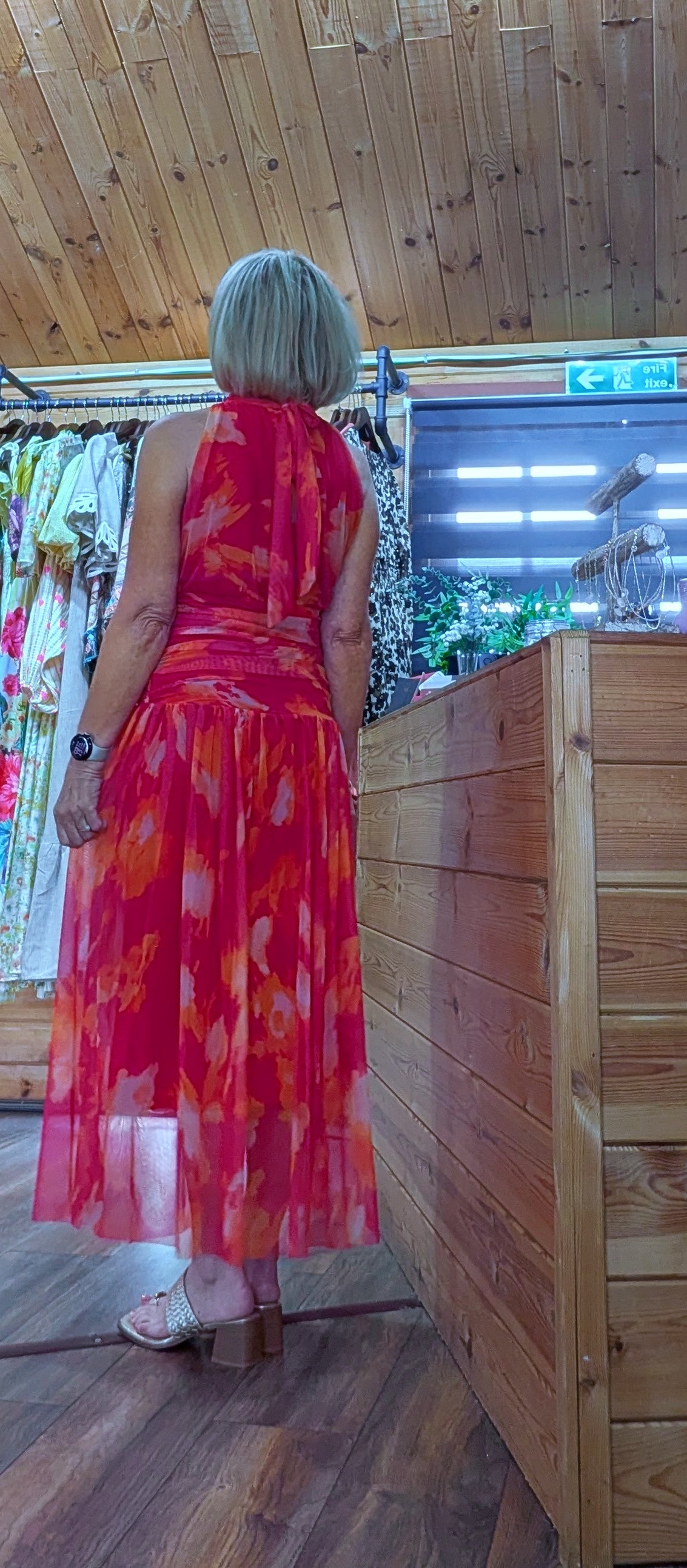Rear view  of Natasha drop waist dress in red