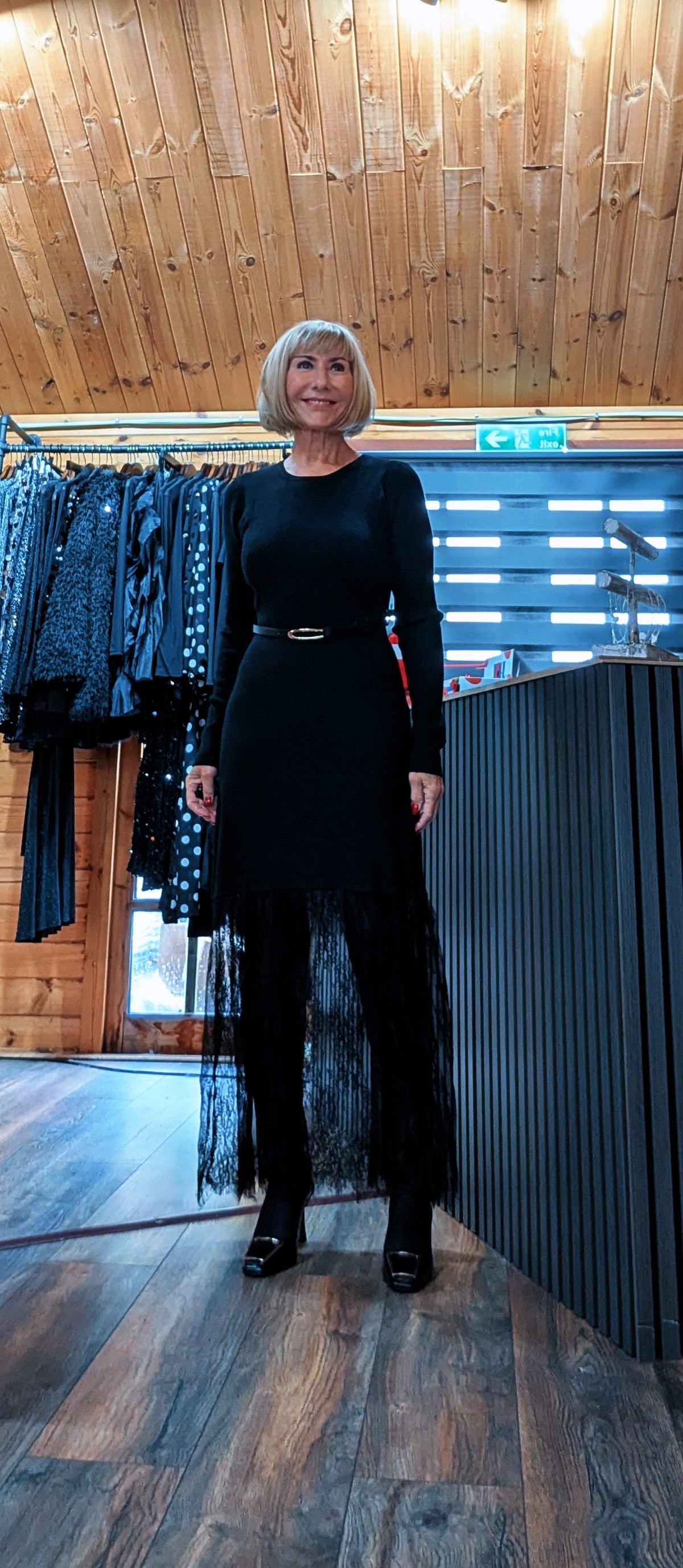 Di wearing the Aoife long-sleeved black dress in the boutique