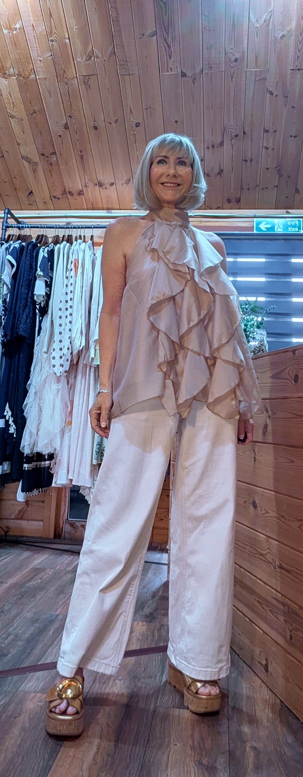 Halterneck backless blouse with frills and high neck backless