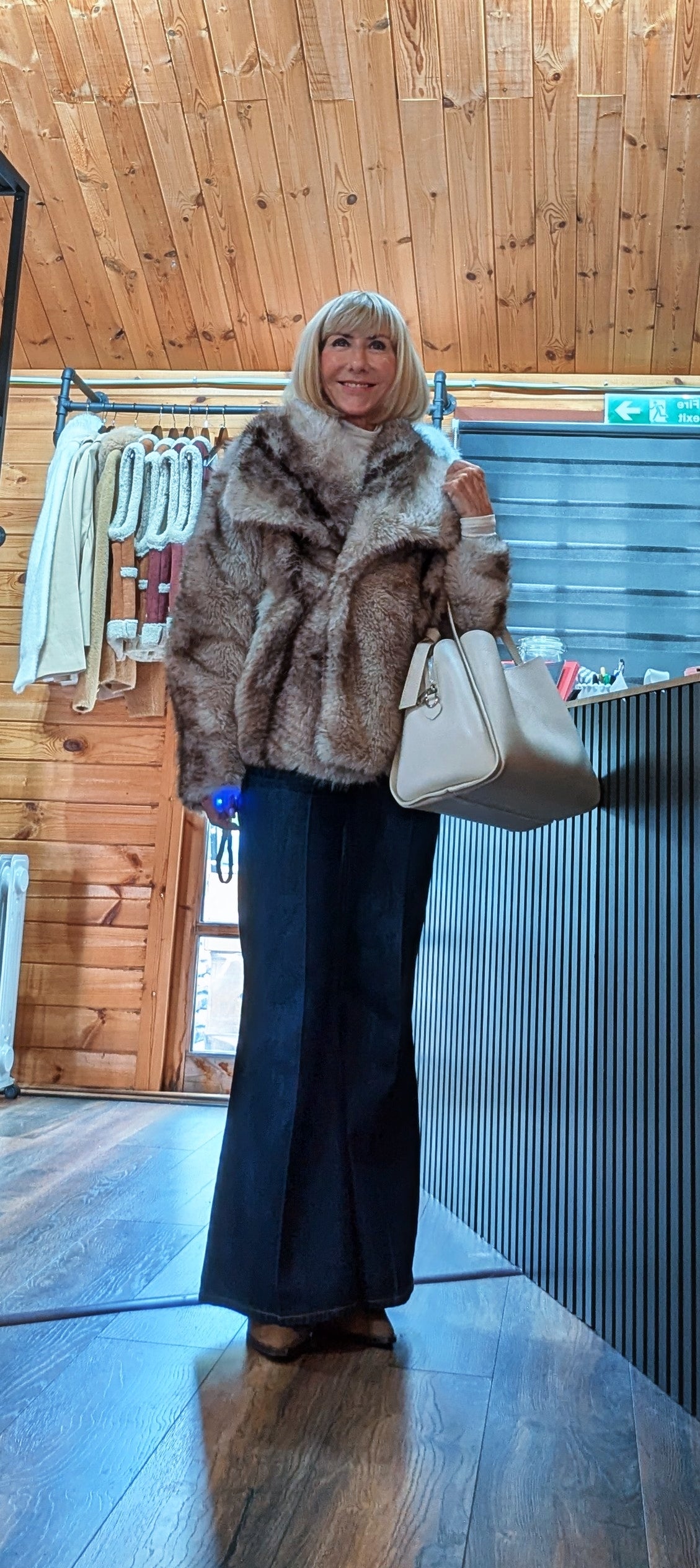 Taupe Charlotte faux-fur jacket styled with black wide-leg jeans