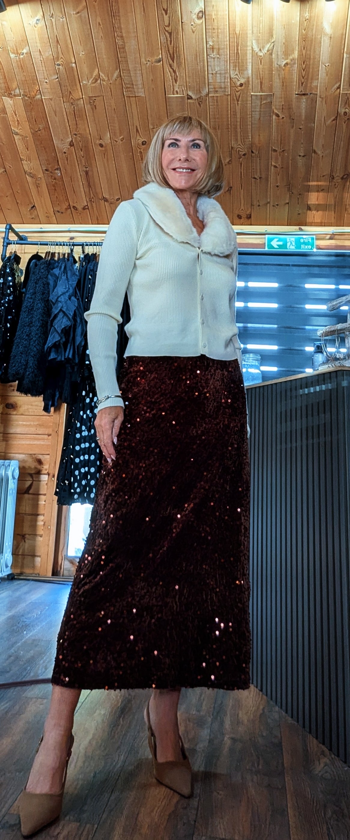 Front view of Astrid sequin skirt showing its gently flared shape and midi length