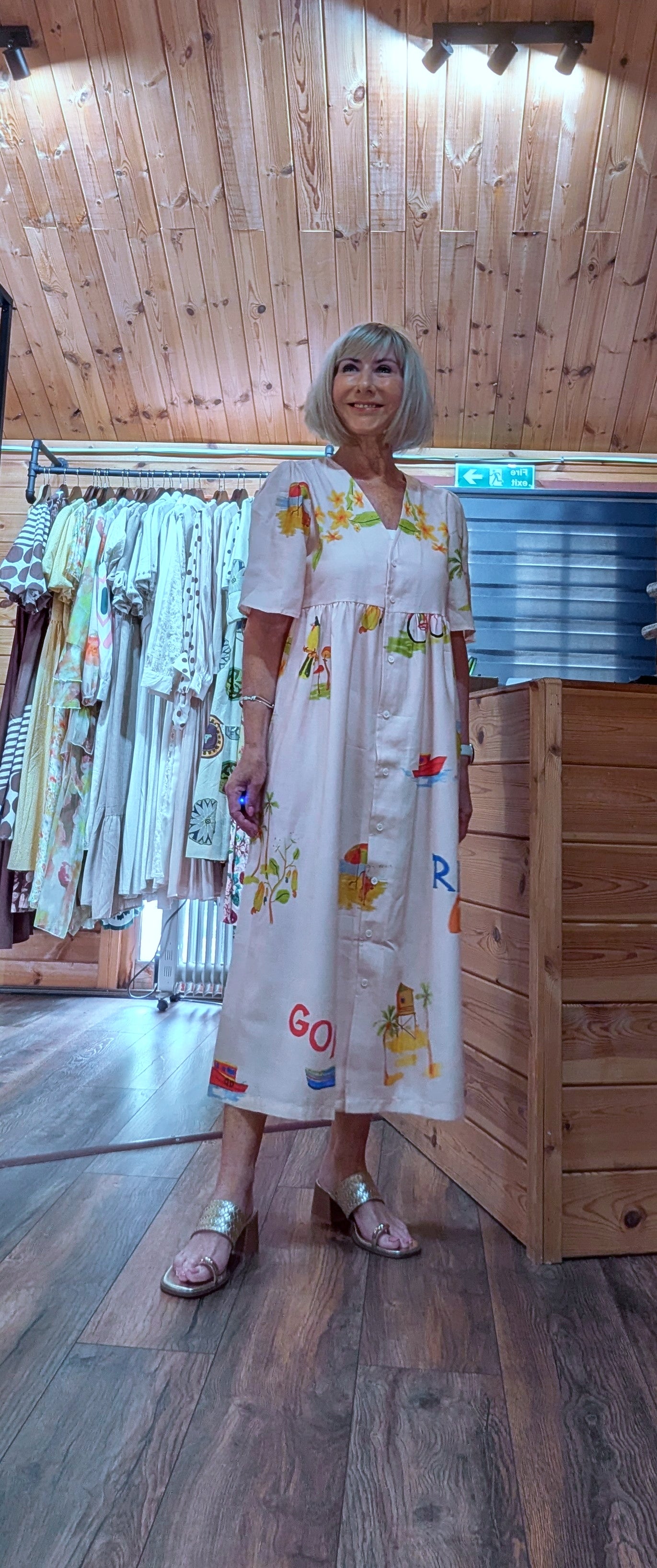 Ivory button-front dress with colourful floral and coastal print