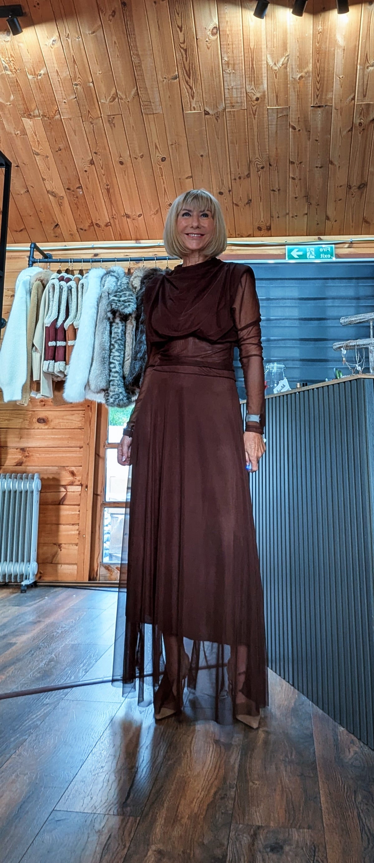 Harlow chocolate draped top and skirt set modelled from the front in the boutique