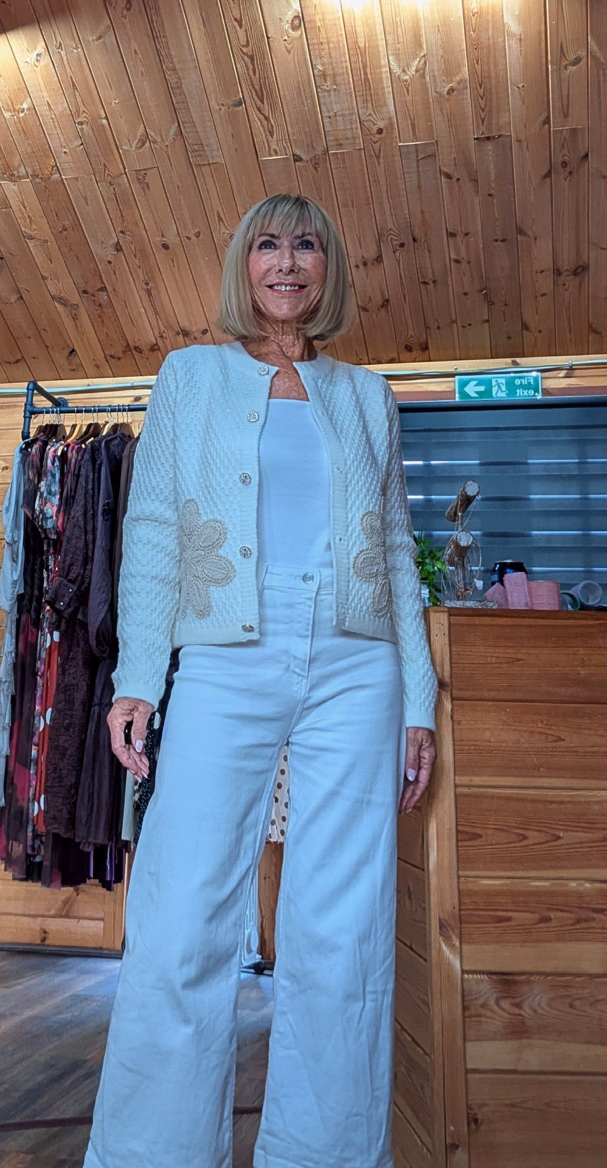 Soft ivory Aviary cardigan styled with white trousers, available at DitsyDi.