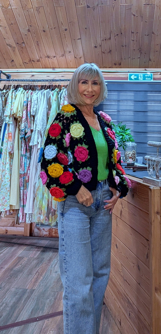 Black statement cardigan with colourful crochet flowers
