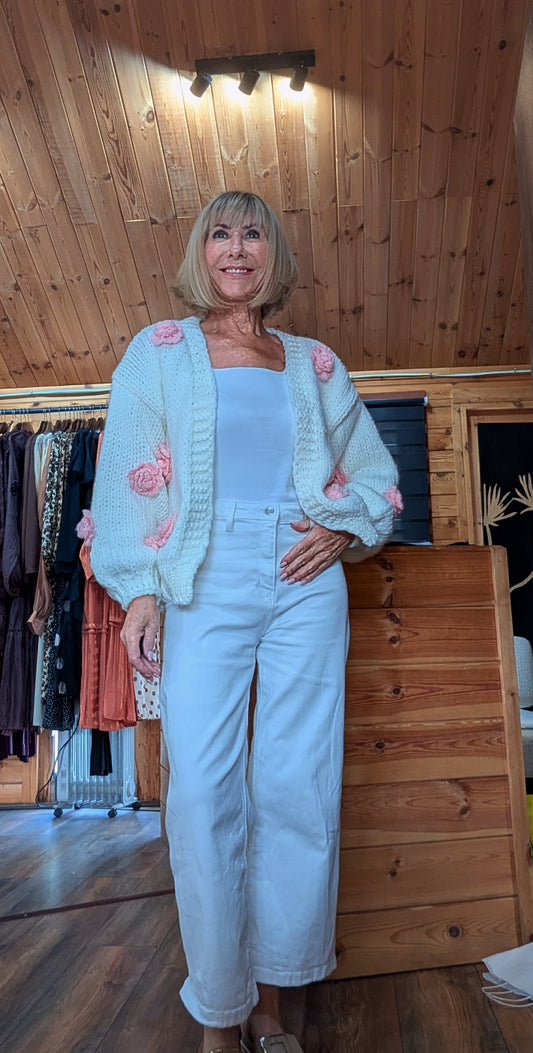 Rose cream knitted cardigan with pink floral appliqué detail and balloon sleeves