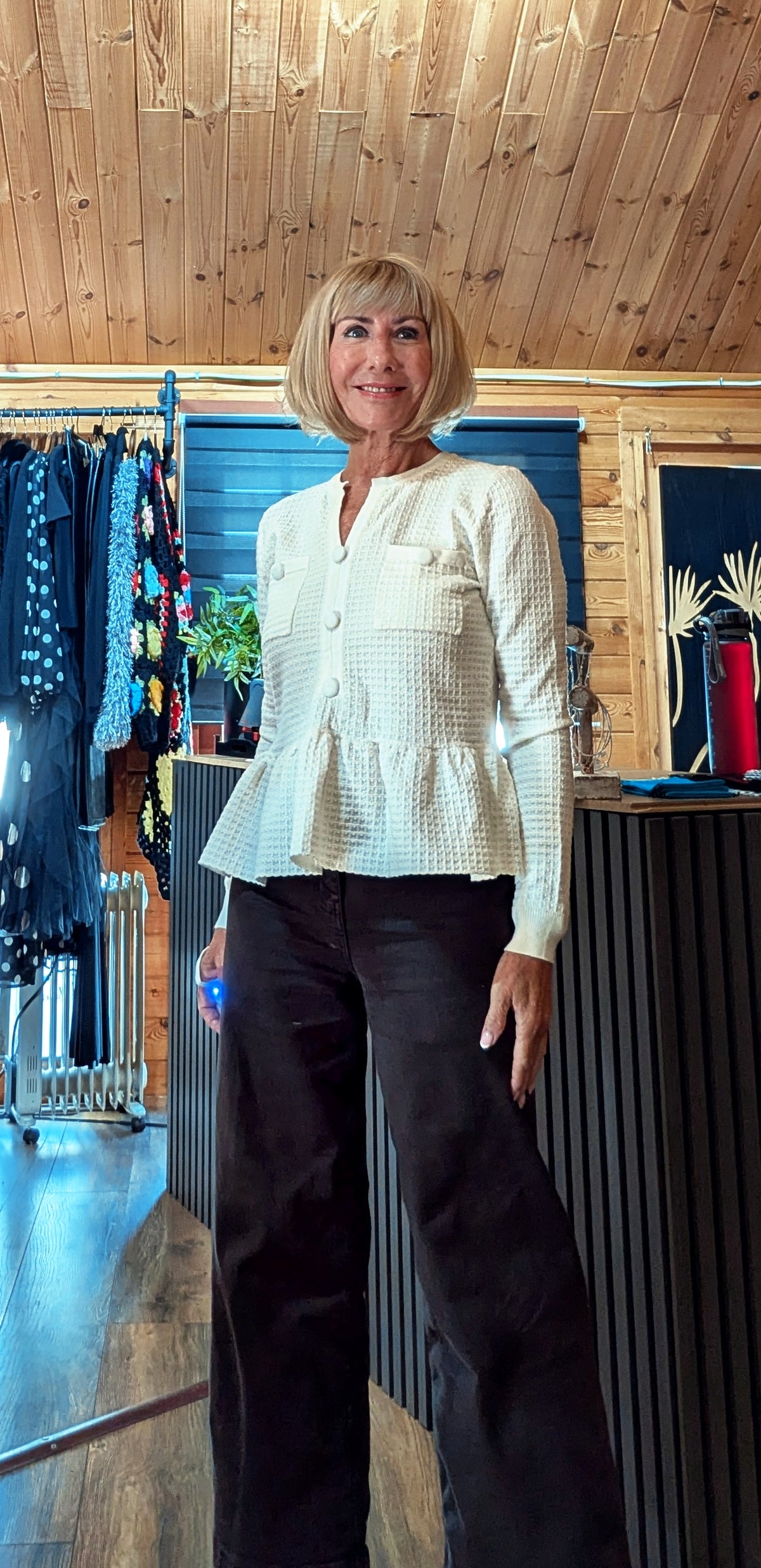 Women’s smart knit top with tonal buttons and gathered hem
