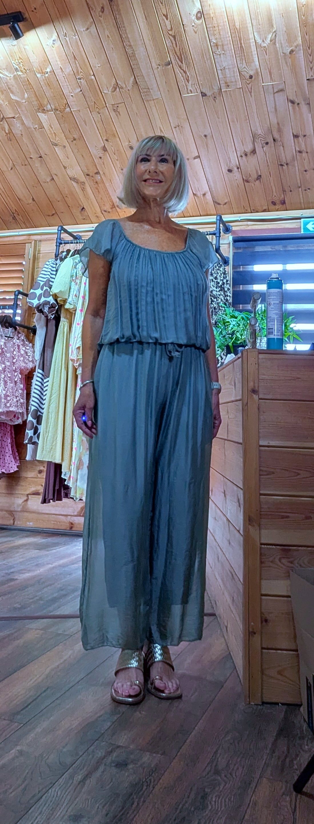 Front view of the Jess aqua silk blend jumpsuit with a soft draped silhouette, elasticated waist and wide-leg design.