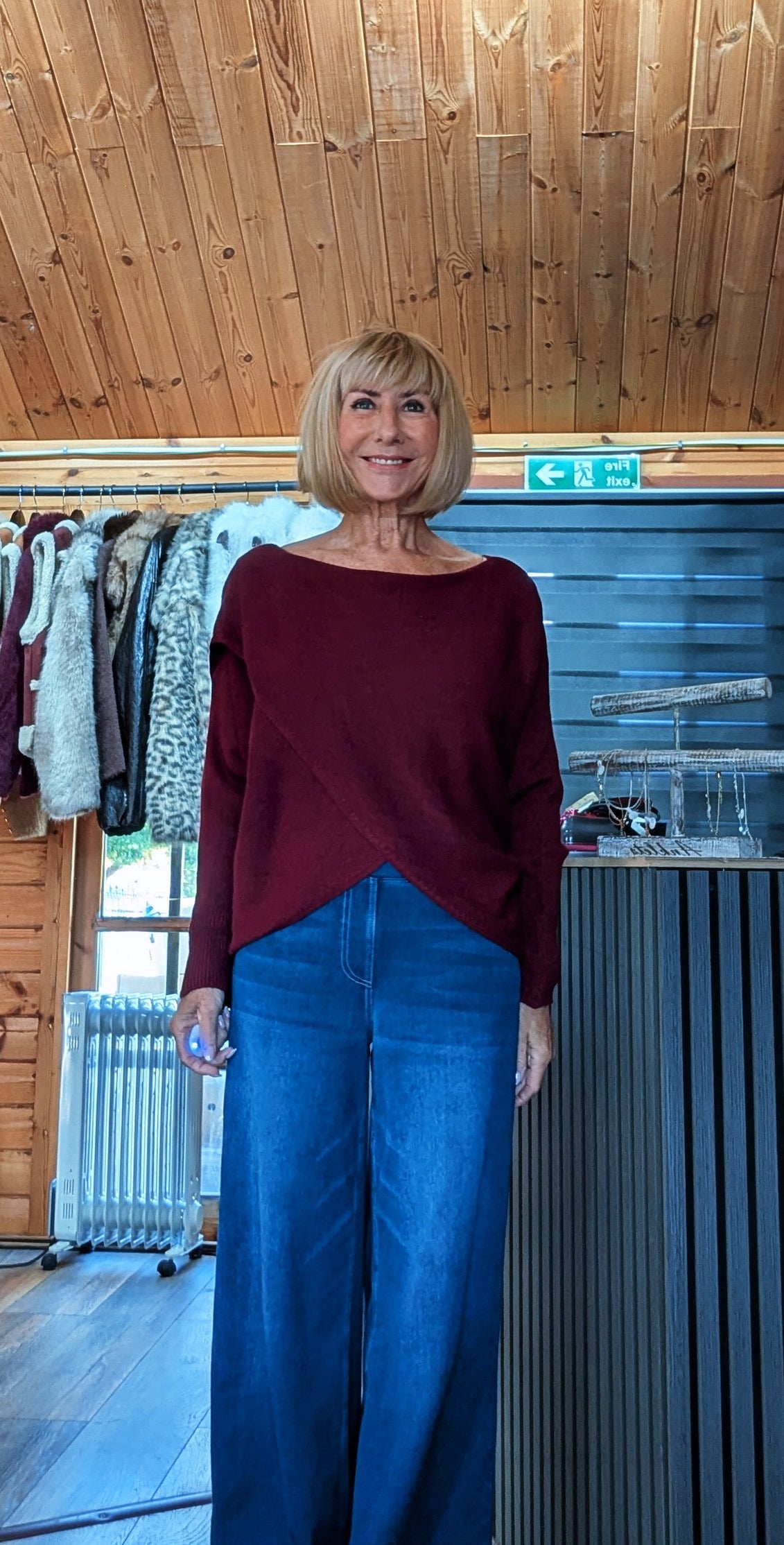 Burgundy off-the-shoulder knit jumper with ribbed cuffs