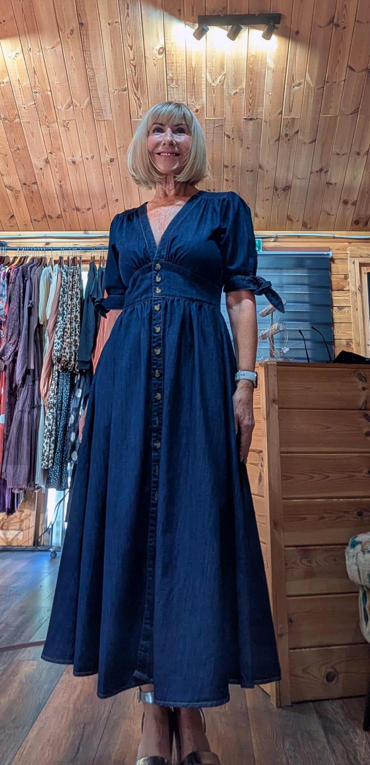 Close up of Binty cottage core prairie dress in dark denim 