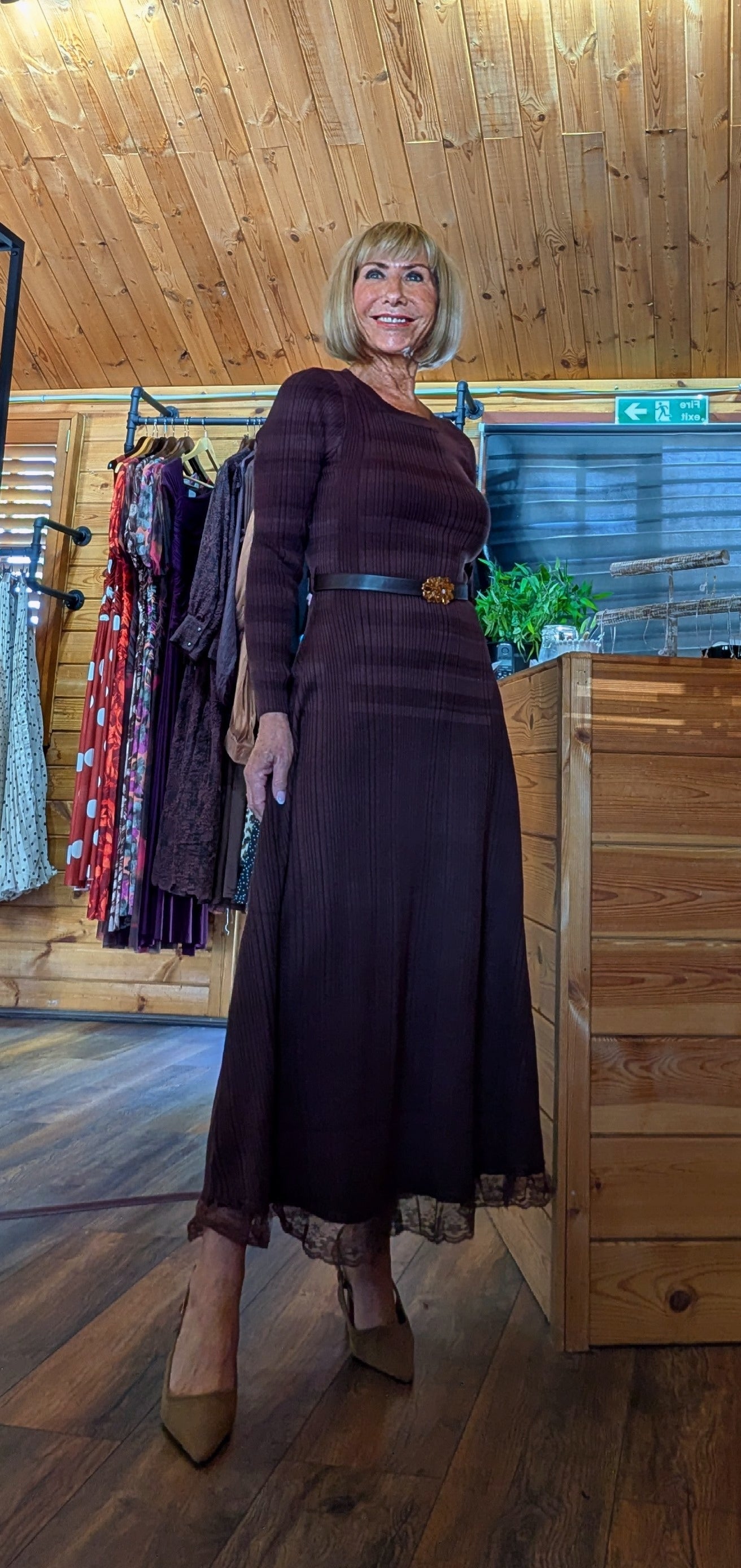 Brown long sleeve midi dress with flared skirt and waist belt
