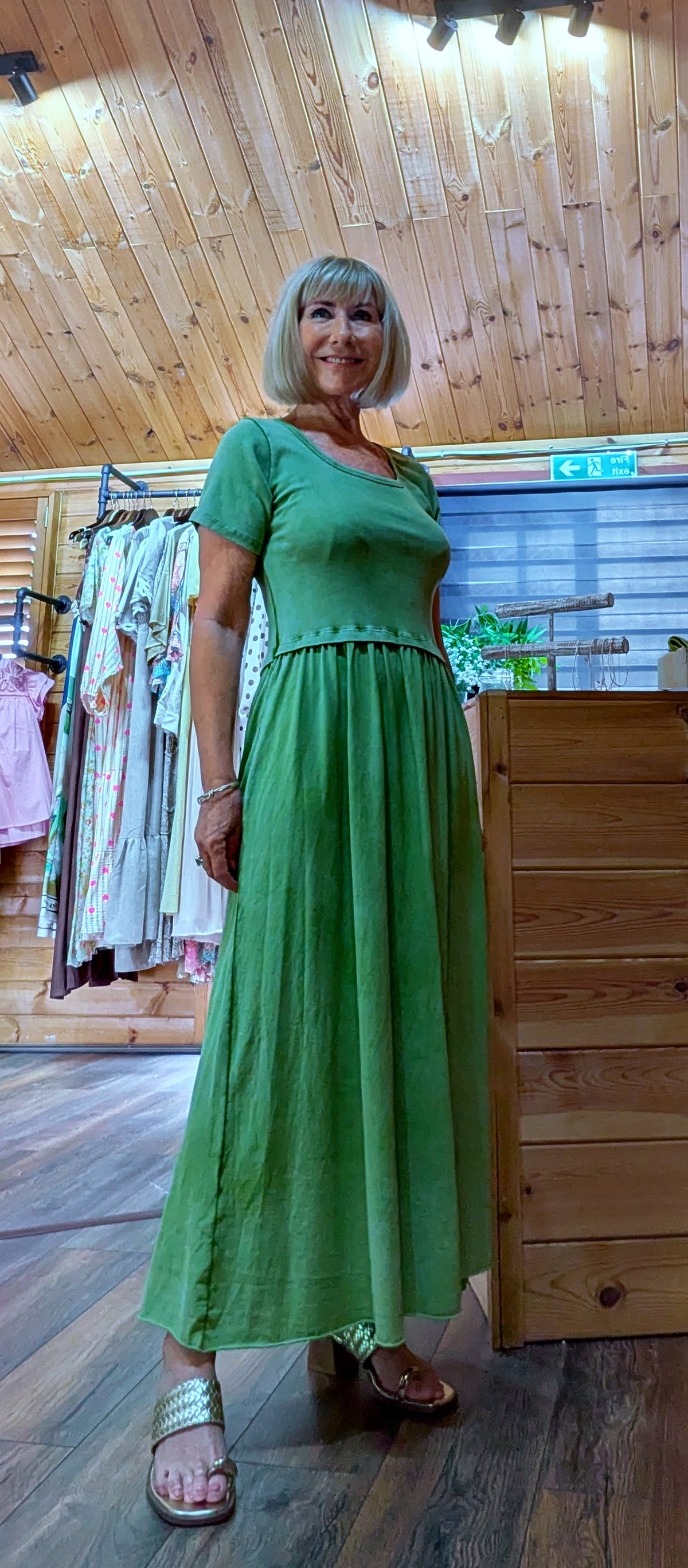 Summer outfit with Ursula T-shirt dress worn with gold thong sandals