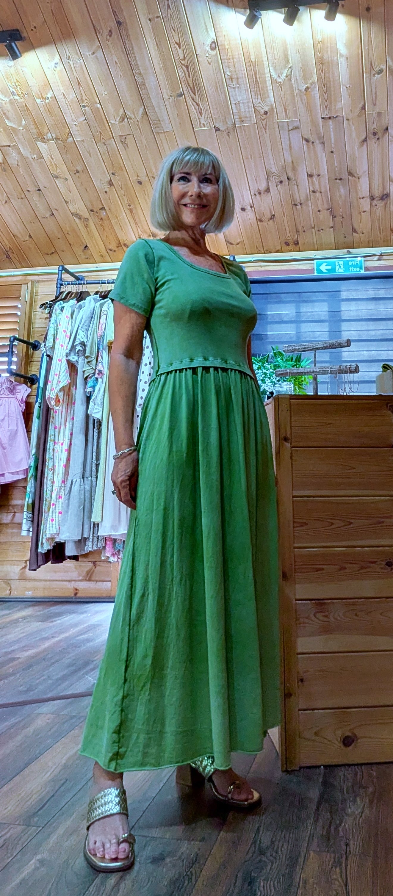 Summer outfit with Ursula T-shirt dress worn with gold thong sandals