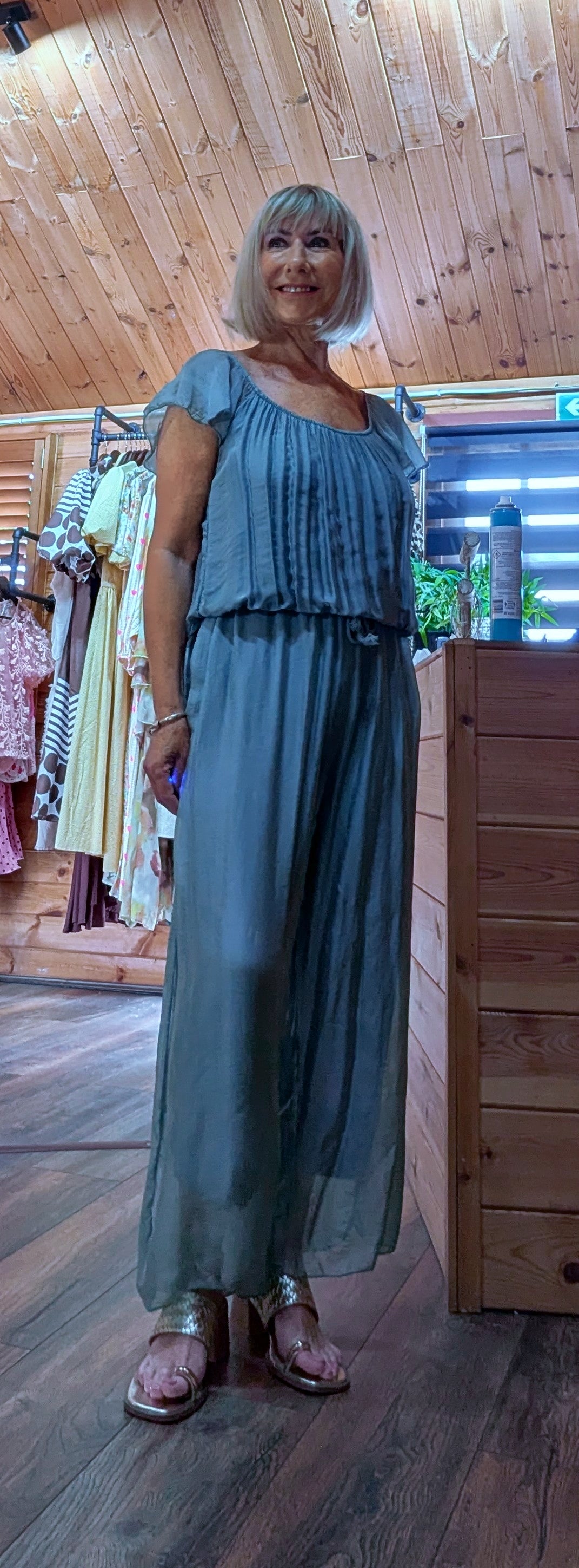 Women's aqua silk blend jumpsuit featuring a wide-leg silhouette, elasticated neckline and comfortable tie waist.