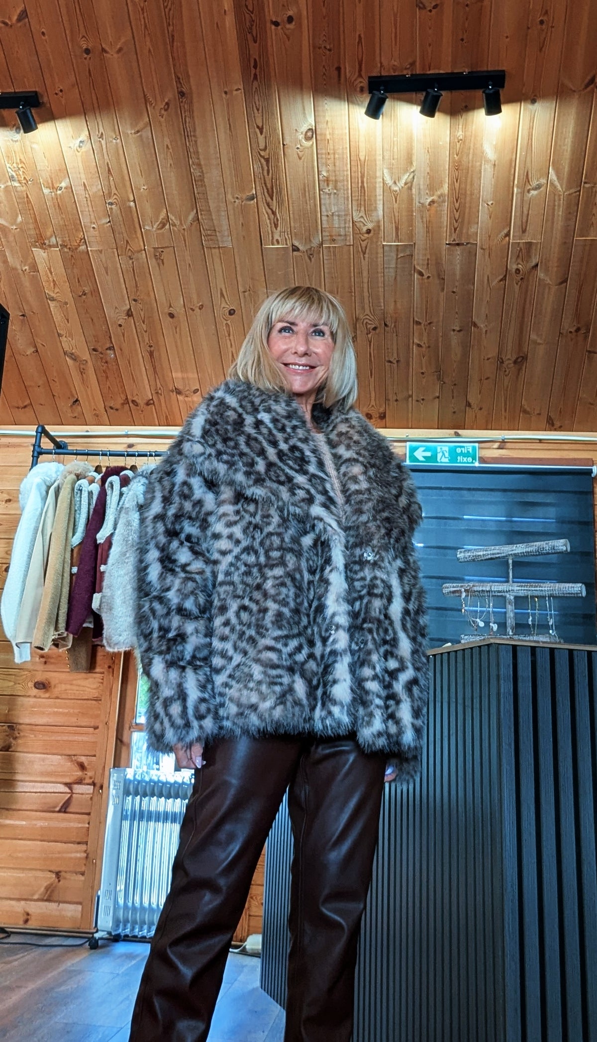 Close up view of a leopard print luxe faux fur jacket