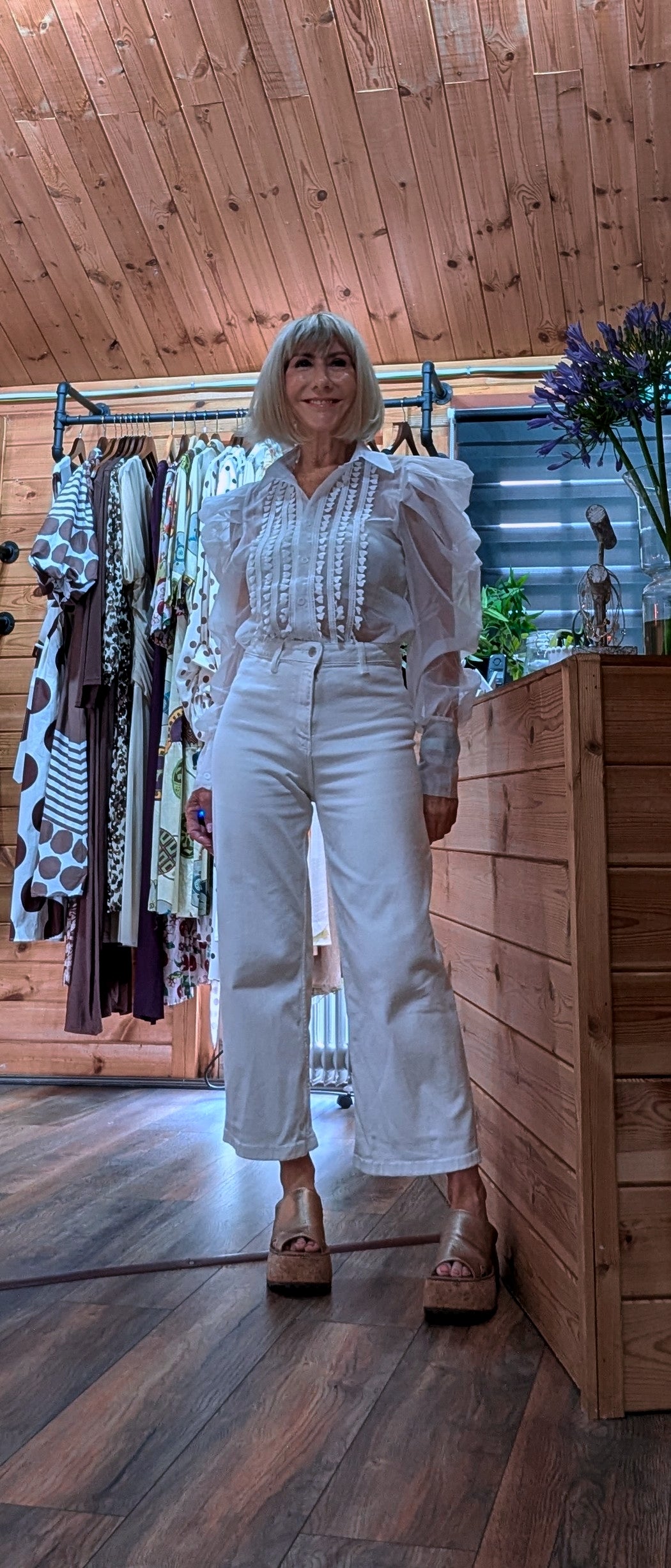Elegant white  long-sleeve blouse with embroidered panels and button-front fastening worn by ditsydi