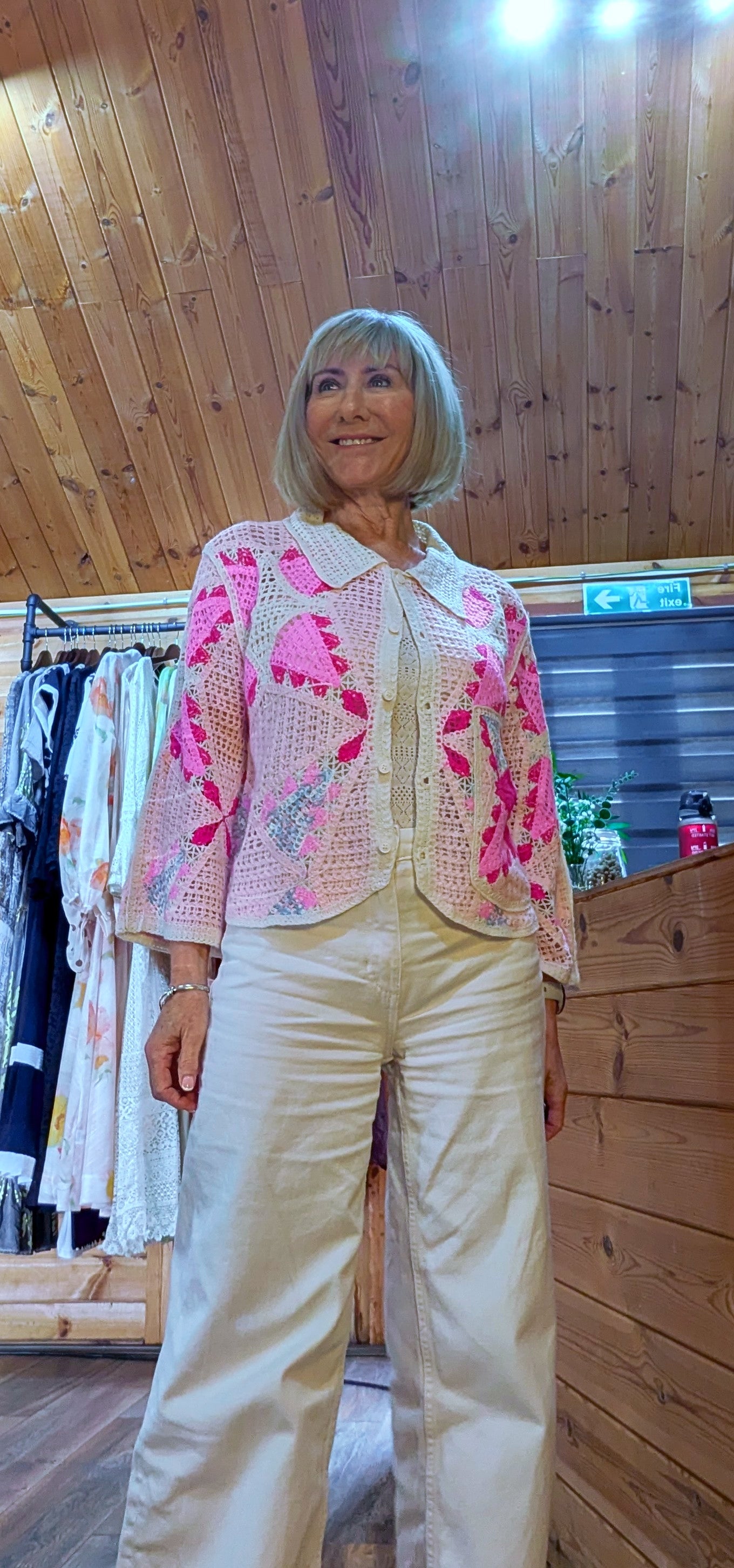 Helen pink crochet cardigan styled with jeans
