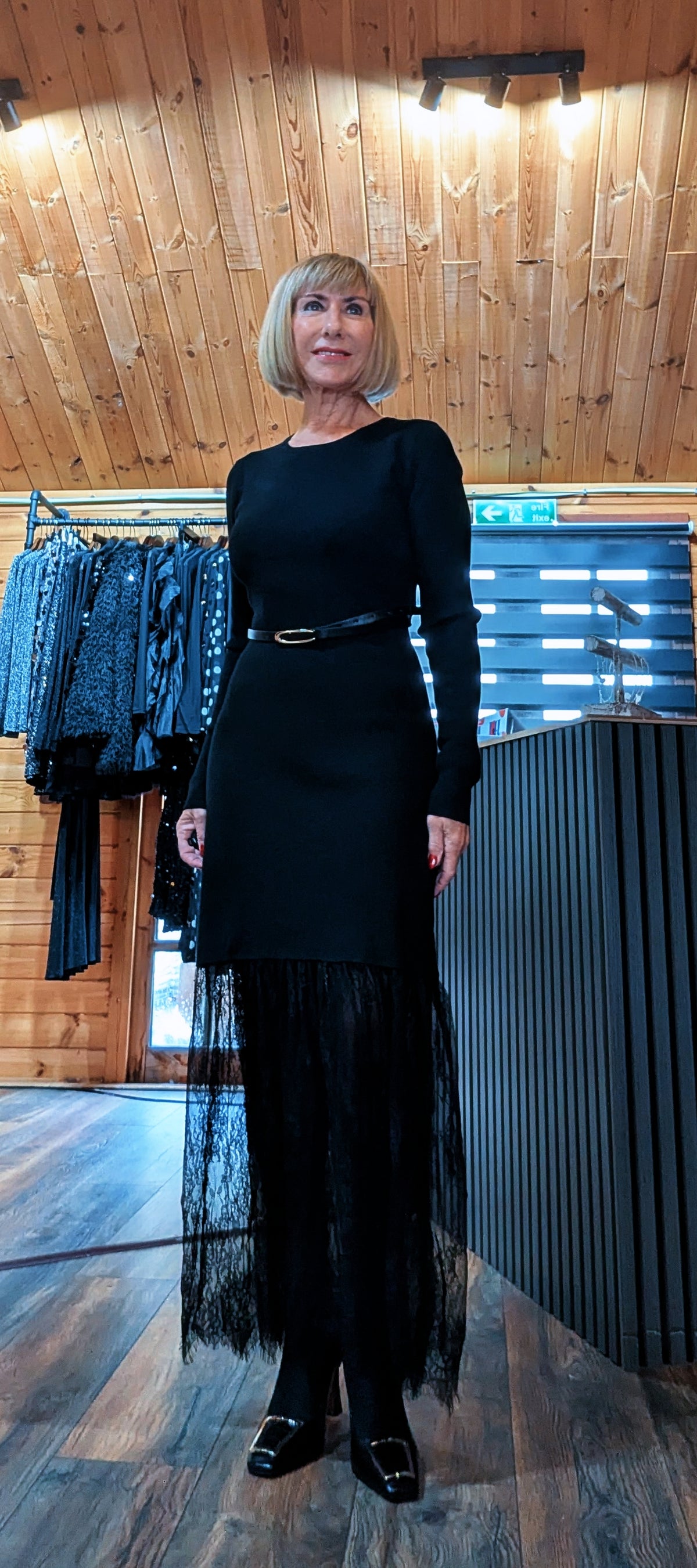 Aoife black belted midi dress viewed from the front, showing the sheer lace lower skirt