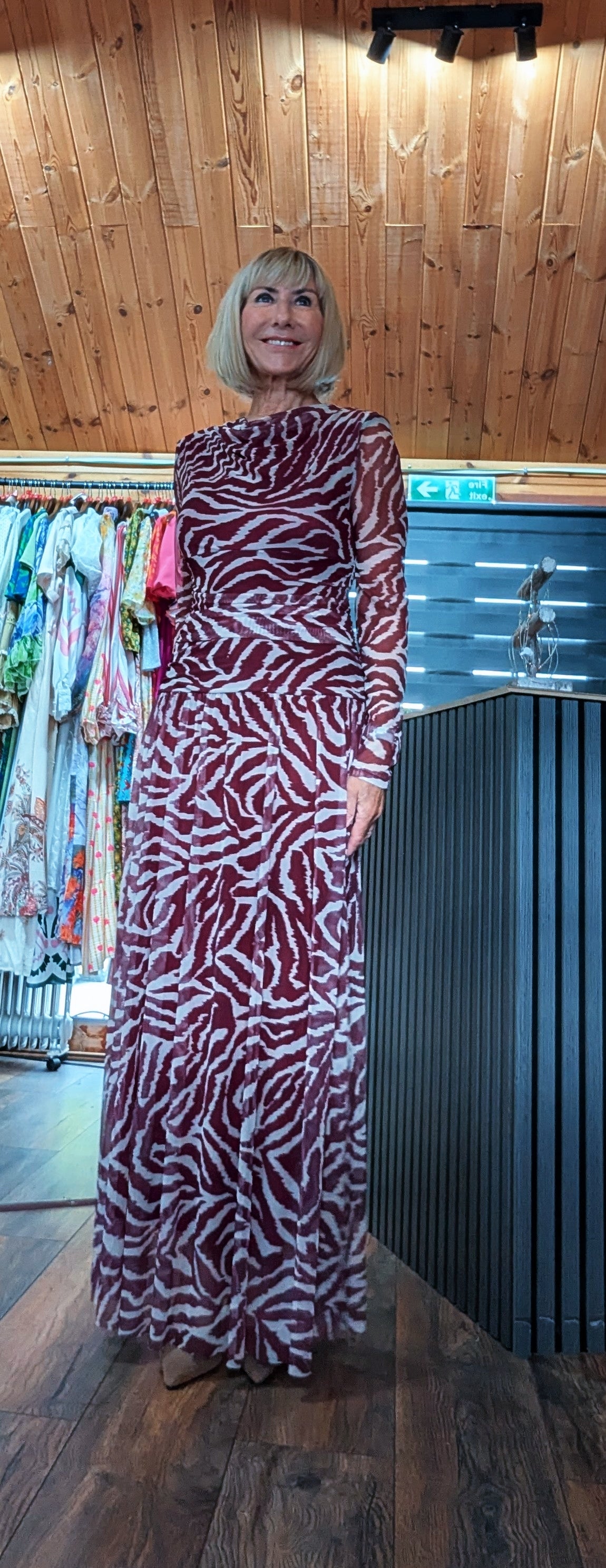 One size animal print maxi dress in chocolate or burgundy with ruched waist and fully lined with mesh skirt