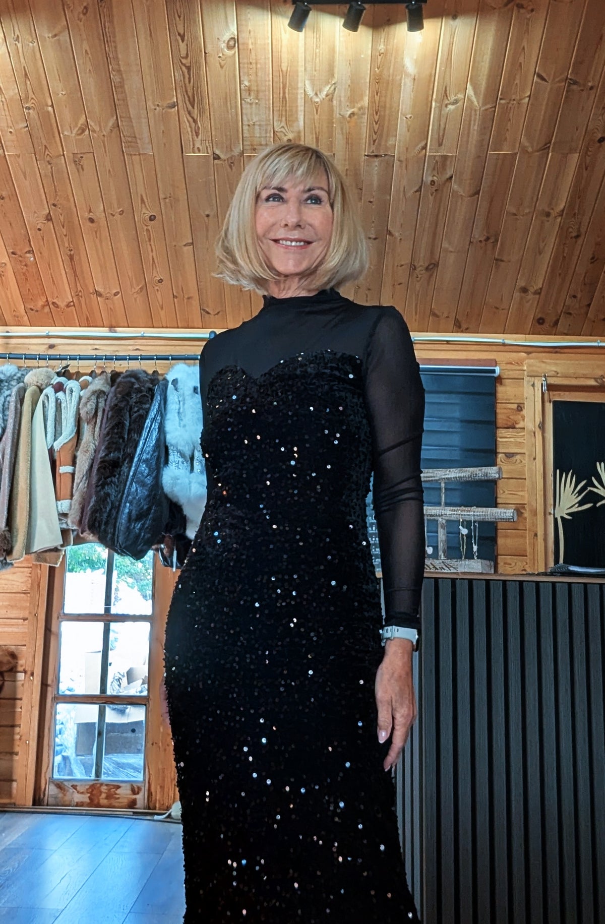 Closer view of Audrey showing the high neckline, sheer shoulder panels and sparkling black bodice.