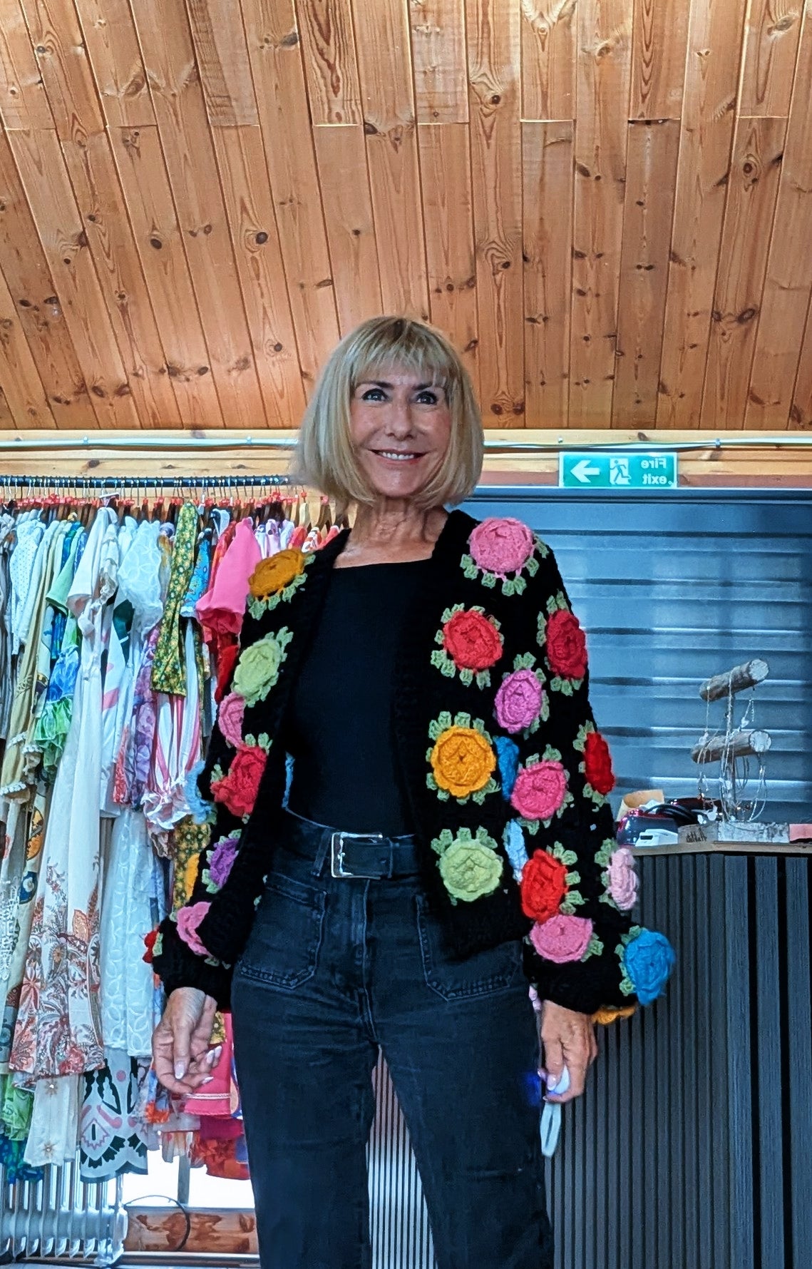 Women’s black open-front crochet cardigan decorated with raised 3D flowers styled by ditsydi  uk boutique
