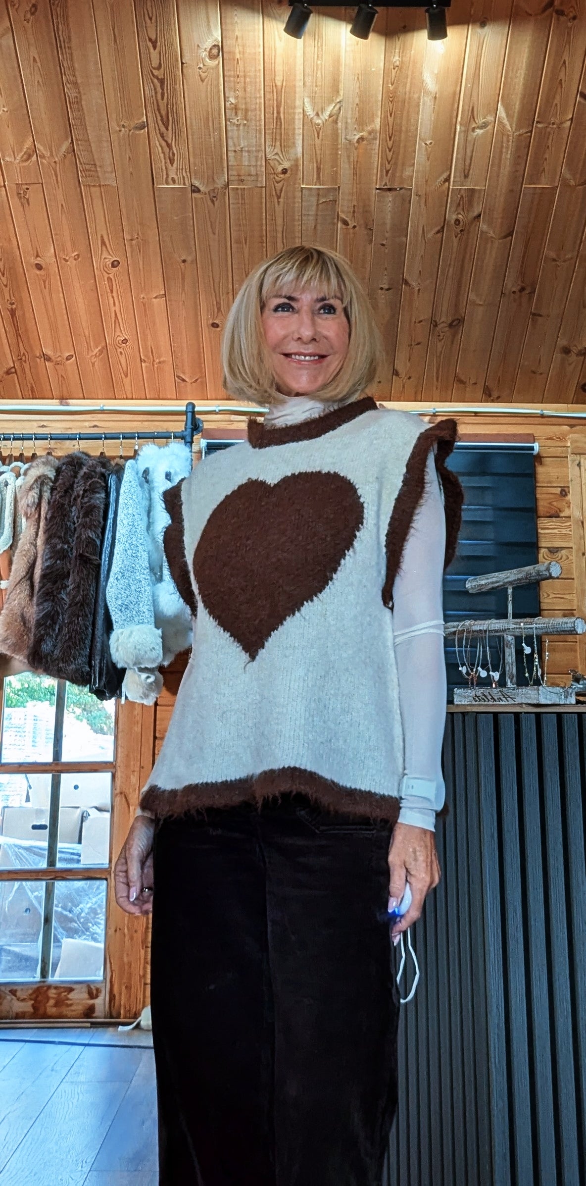 Closer front view of Maura sweater showing the chocolate-brown heart and contrast shoulder trims