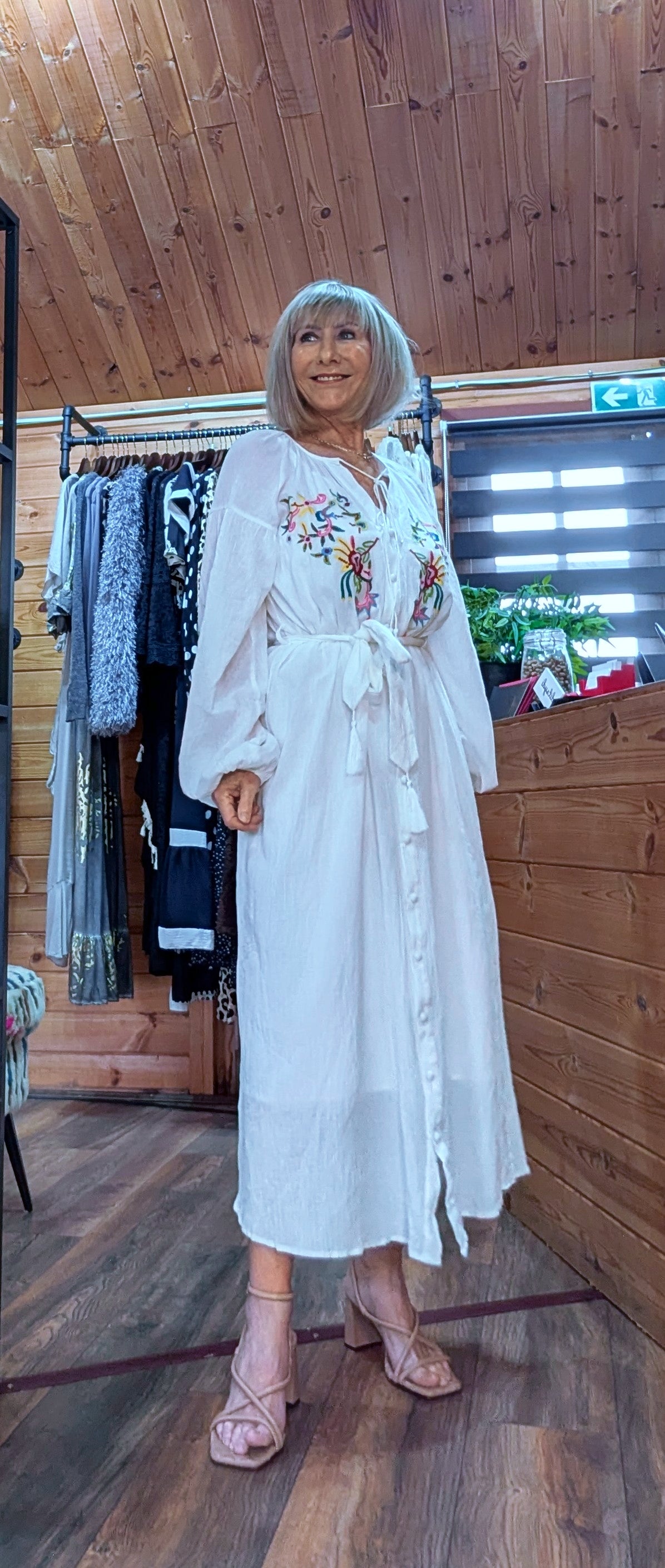 White cotton maxi dress with colourful embroidery and attached inner slip