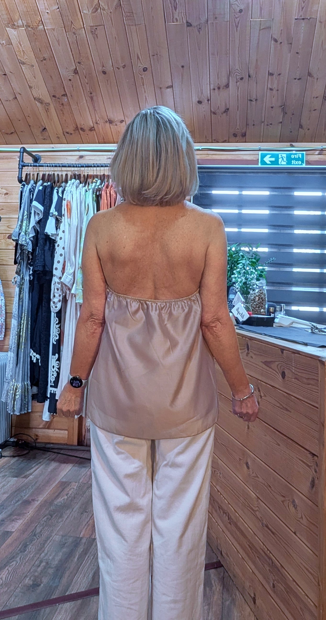 Close up of Noori backless halterneck frill blouse uk