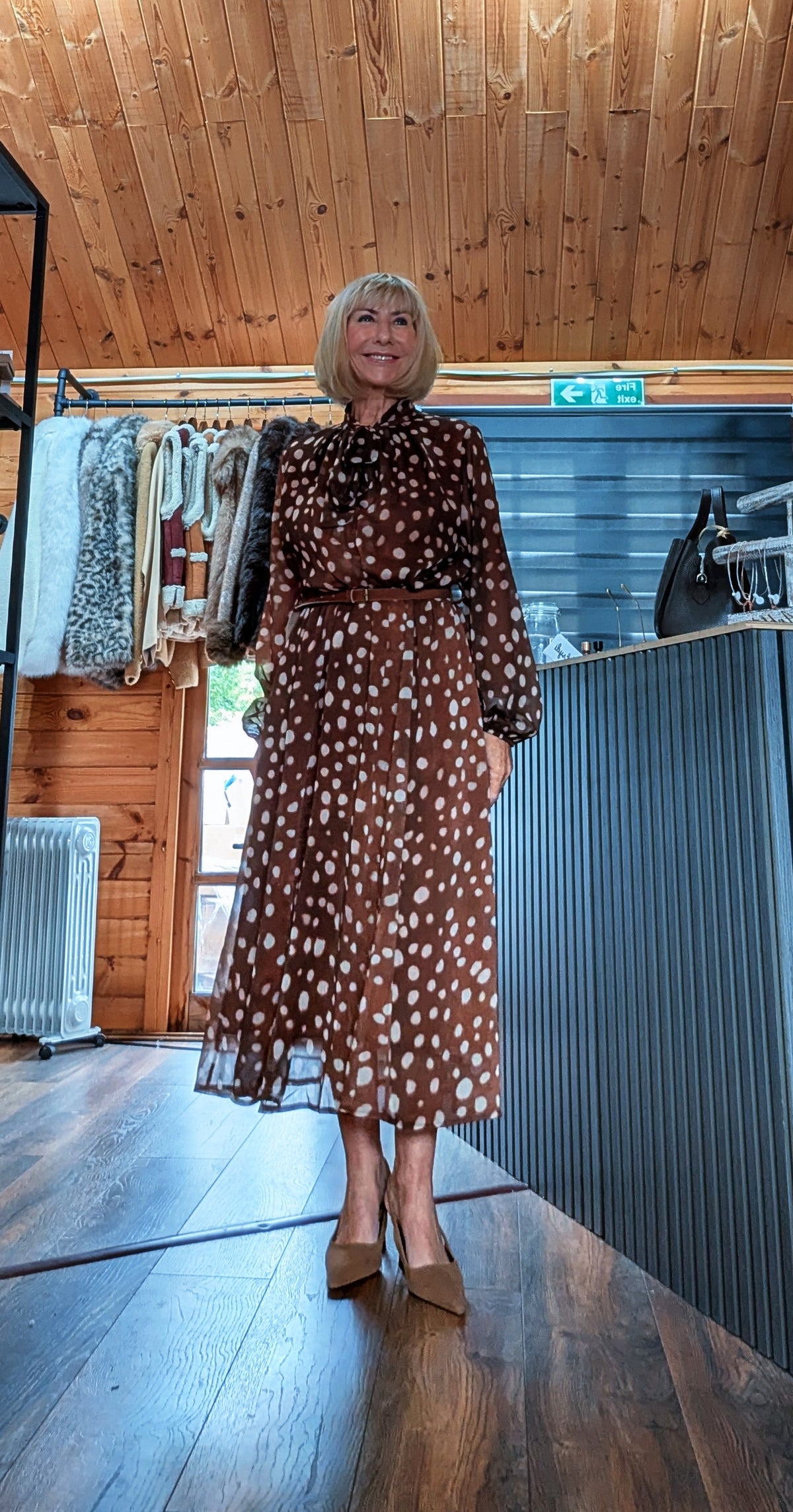 Full-length view of Dorothy belted midi dress worn with neutral pointed heels
