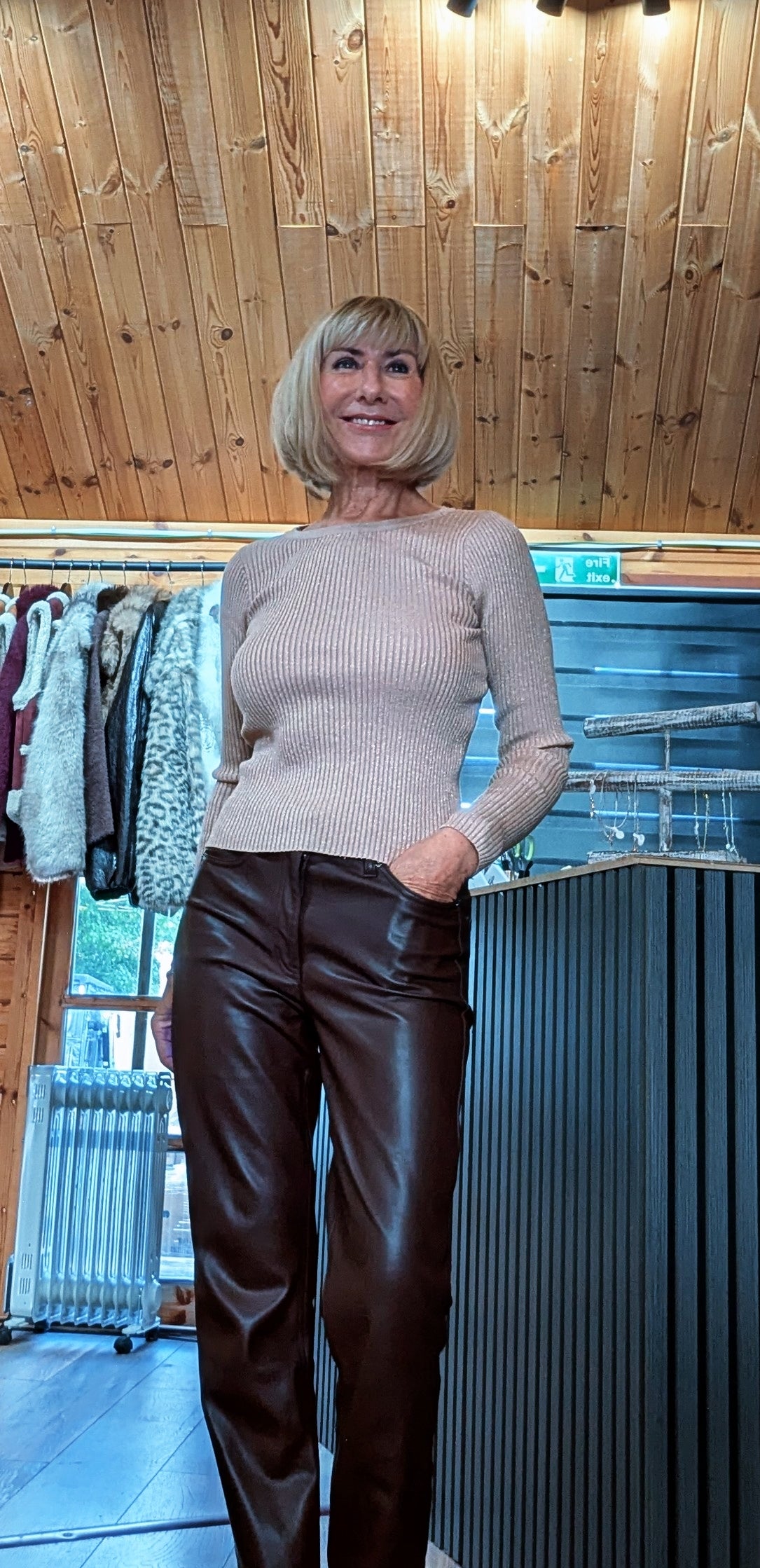 Long sleeve gold top styled with brown pleather trousers