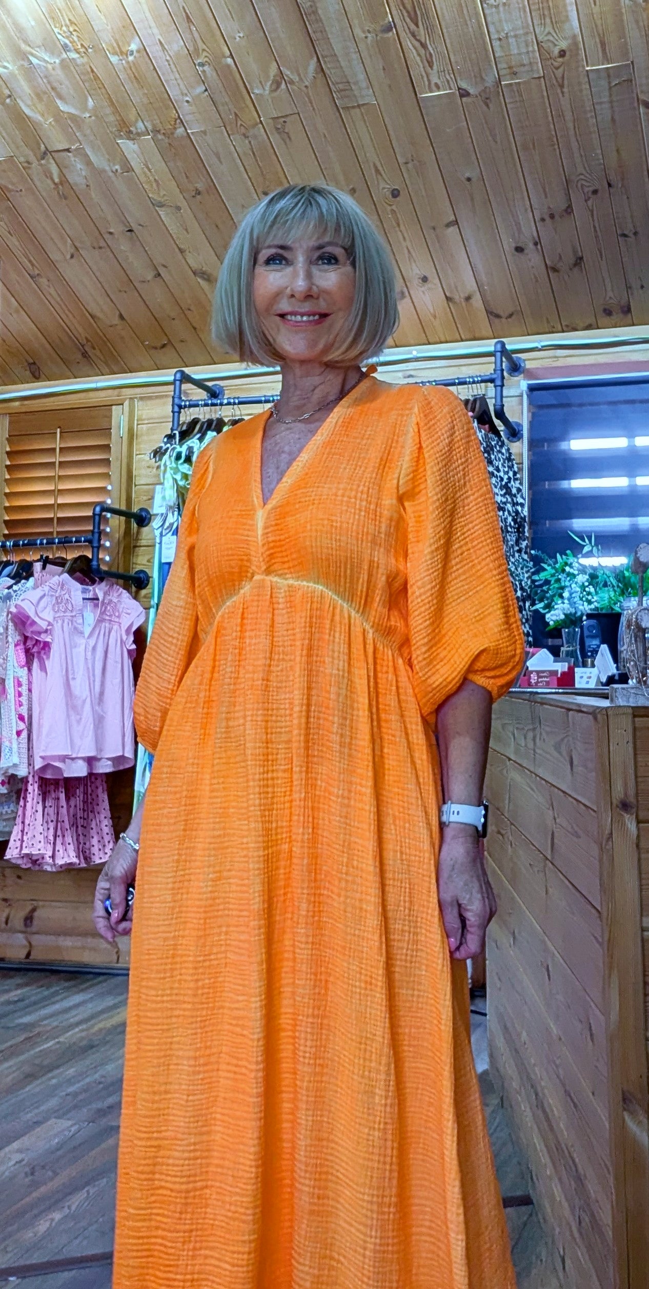 Close up of Roma dress in cheesecloth orange dress
