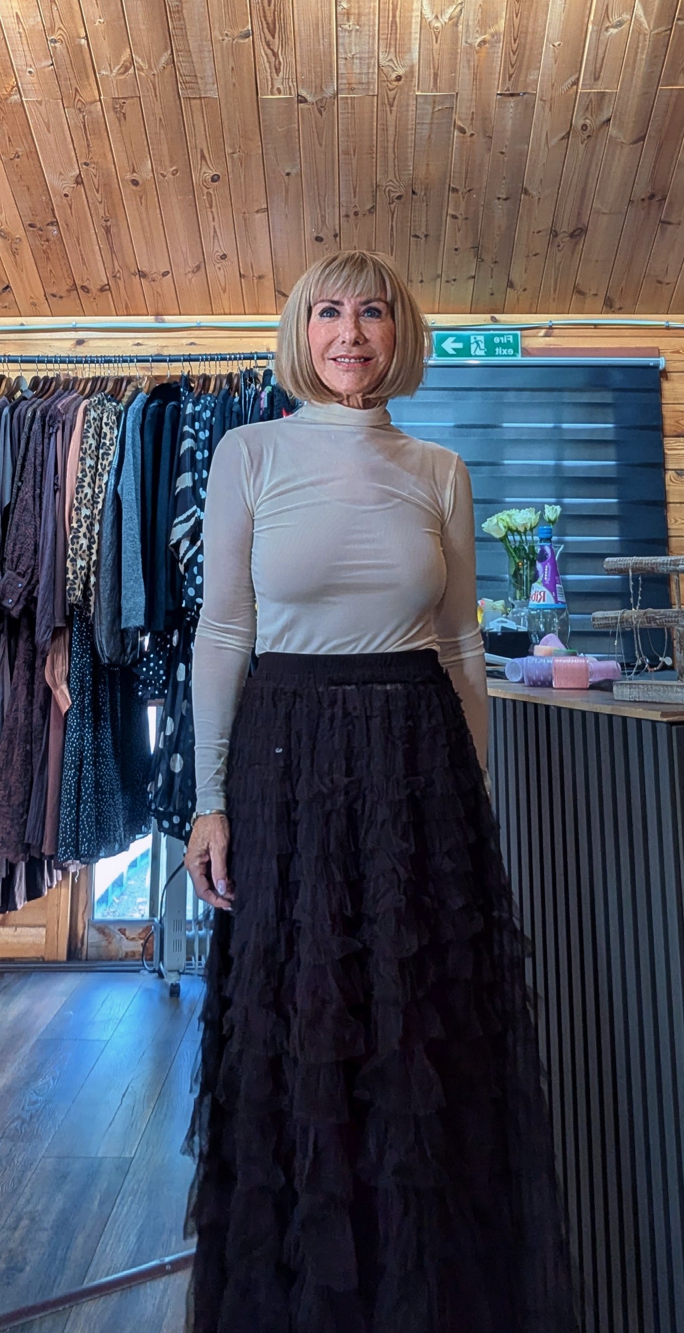Sheer high neck women’s top styled with camisole