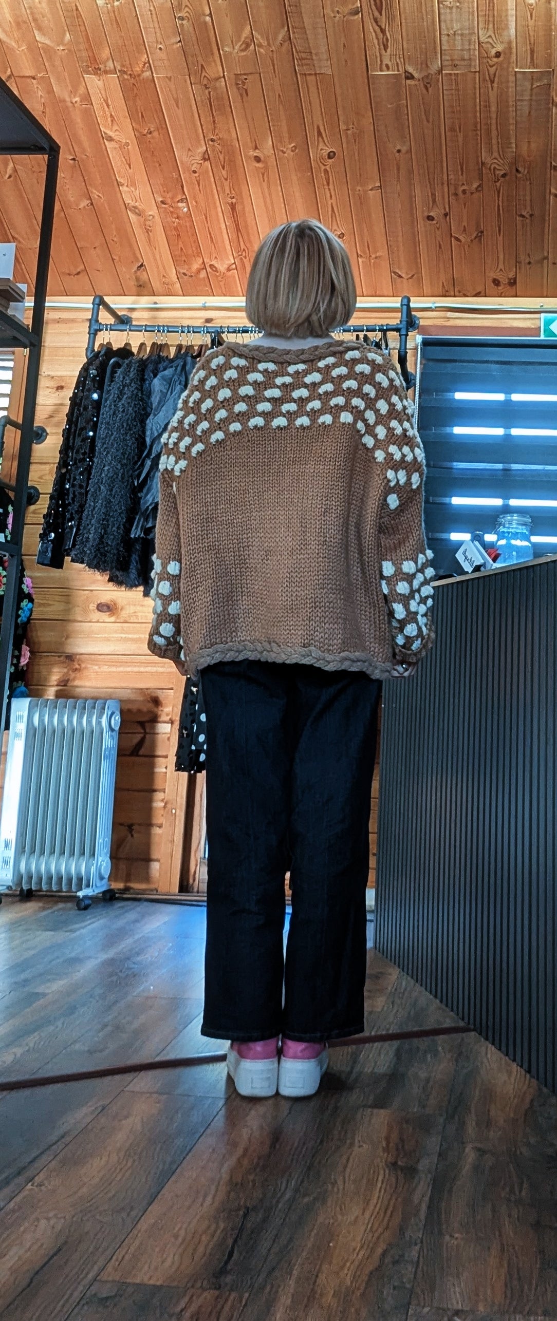 Back view of Abby cardigan showing cream bobble detailing across the shoulders and sleeves