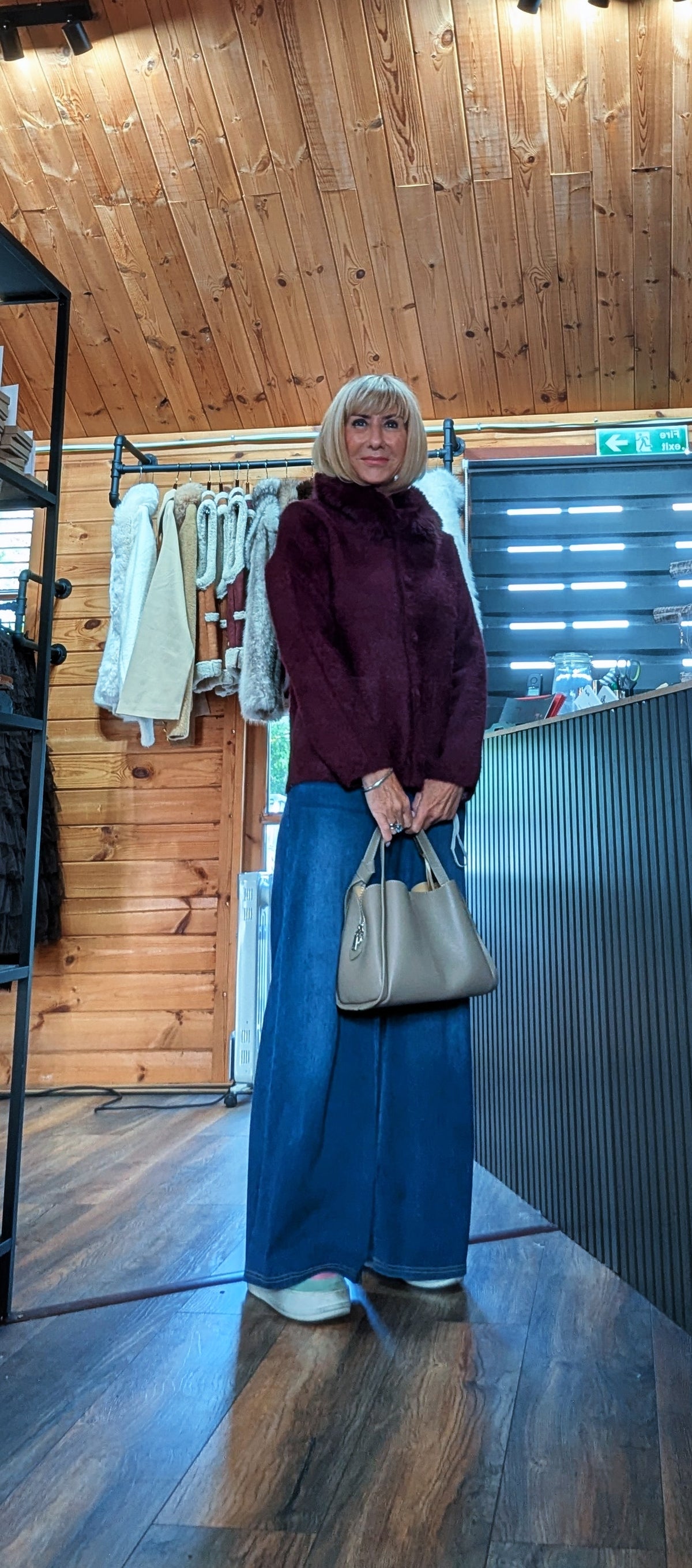 wearing the Amaryllis chocolate faux-fur collar cardigan with wide leg jeans