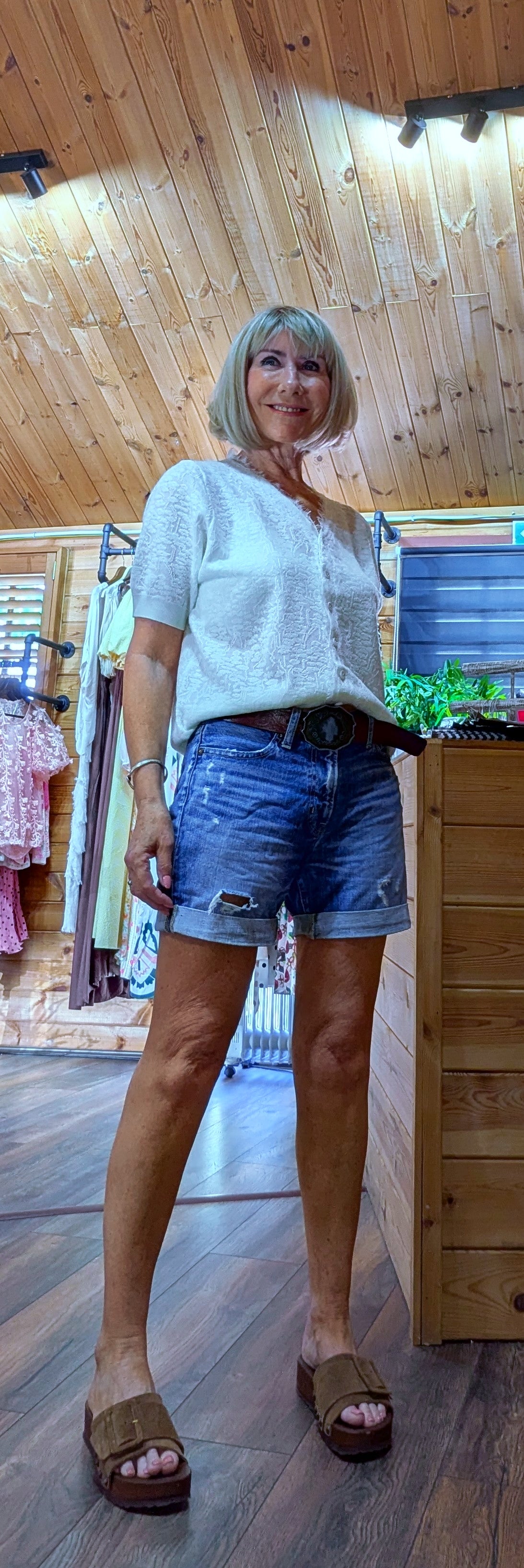 Side view of the Adeline cream viscose knit top showing its flattering fit, lightweight knit and short sleeves. One size fits UK 8–14.