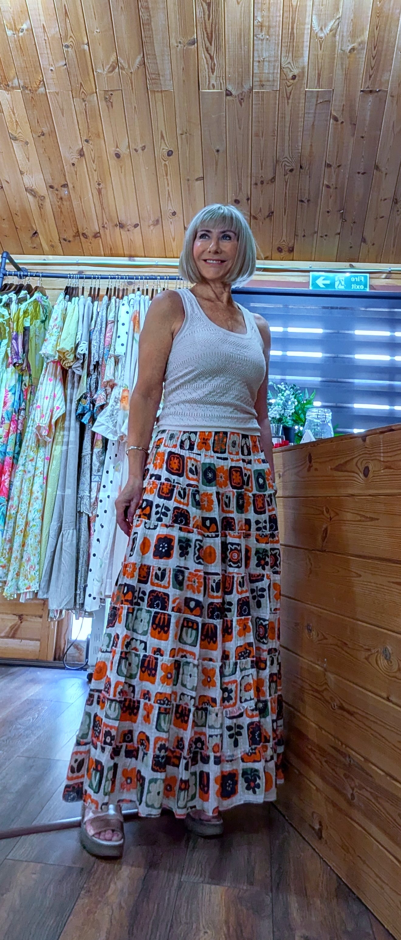 Printed cotton maxi skirt styled with  a cream vest
