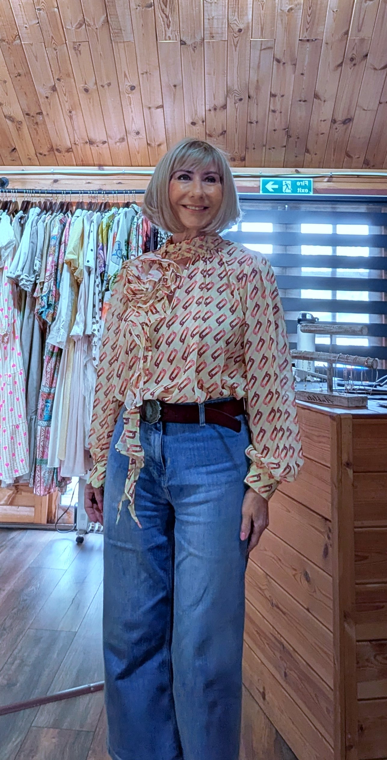 Close up Model wearing the Emery floral detail blouse styled with jeans
