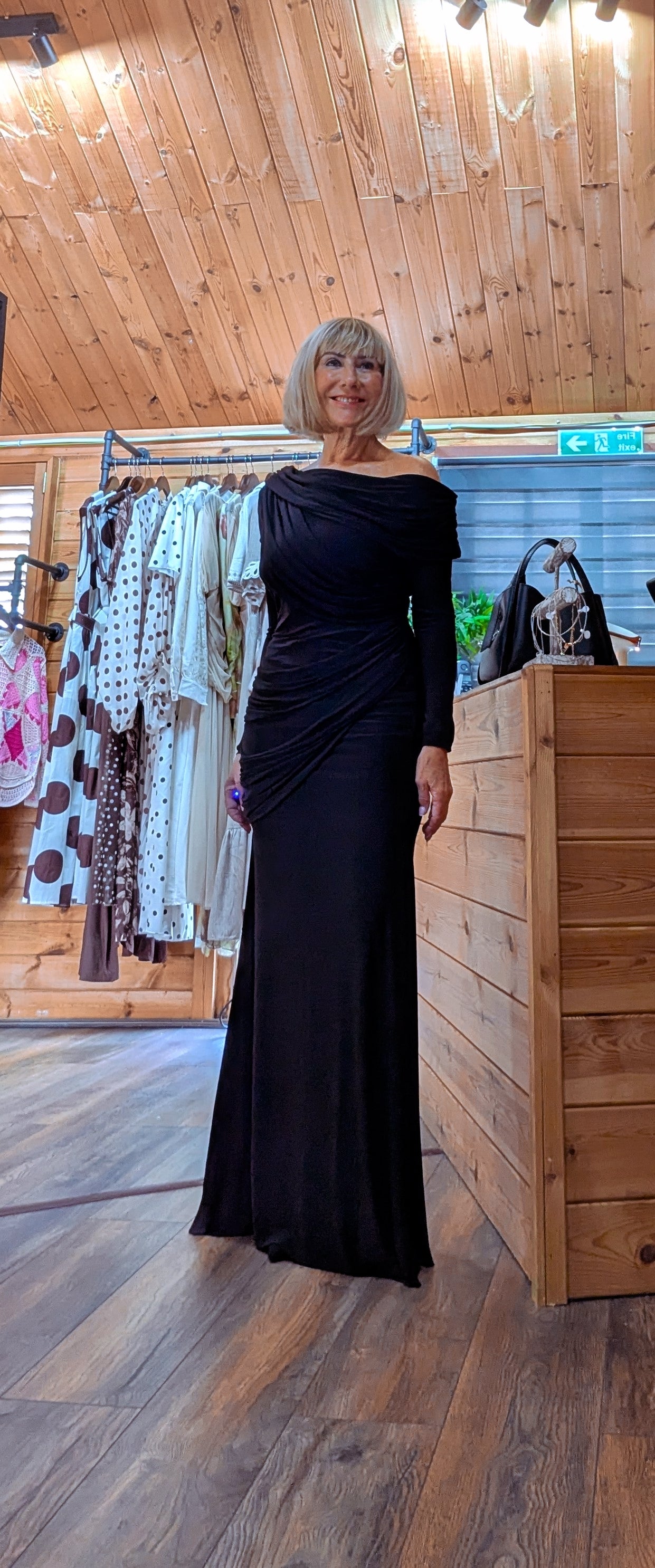 Tilda fitted black maxi dress featuring soft ruching through the waist and hips.