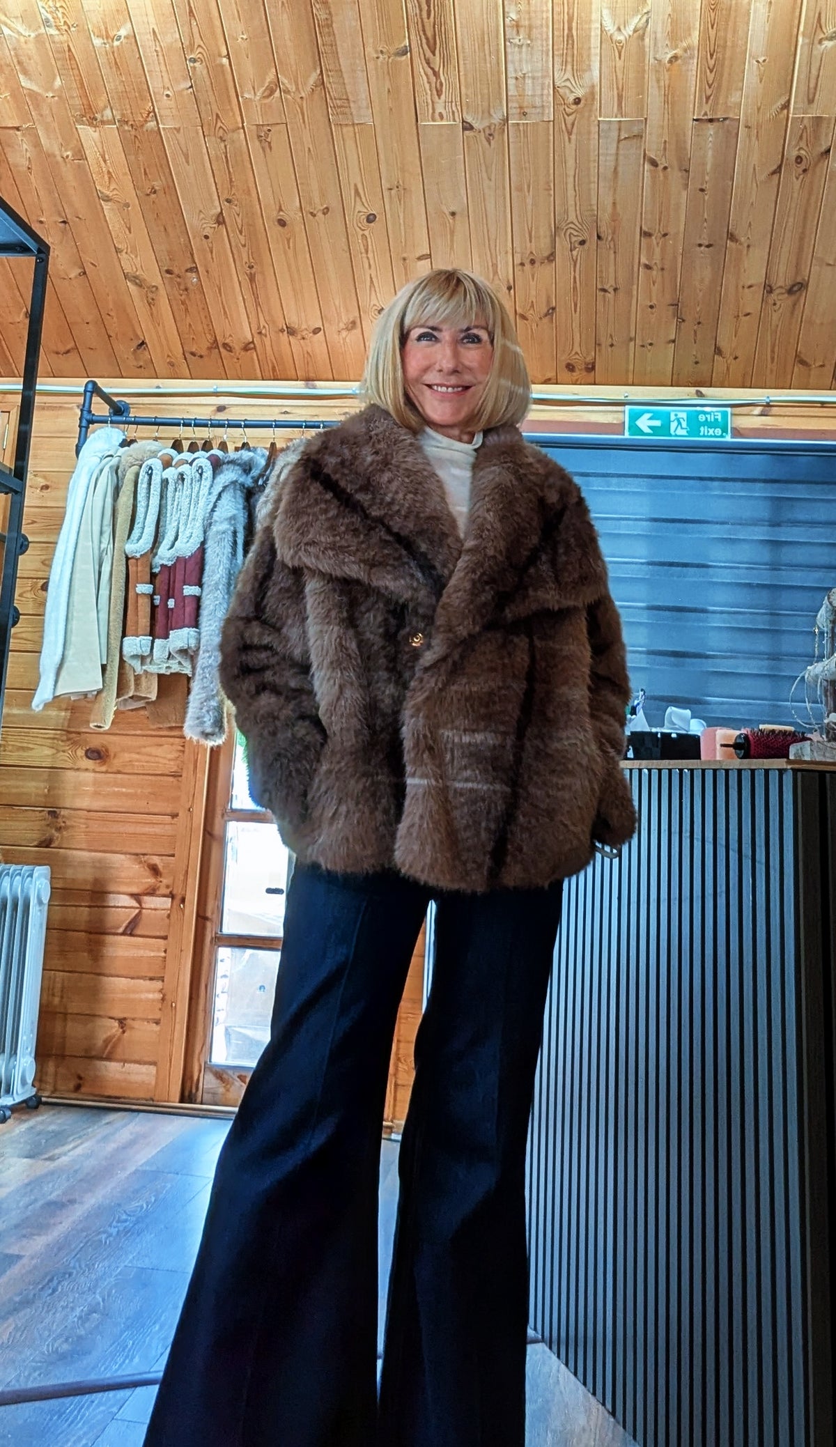 Chocolate brown faux-fur jacket with wide lapel collar and front fastening