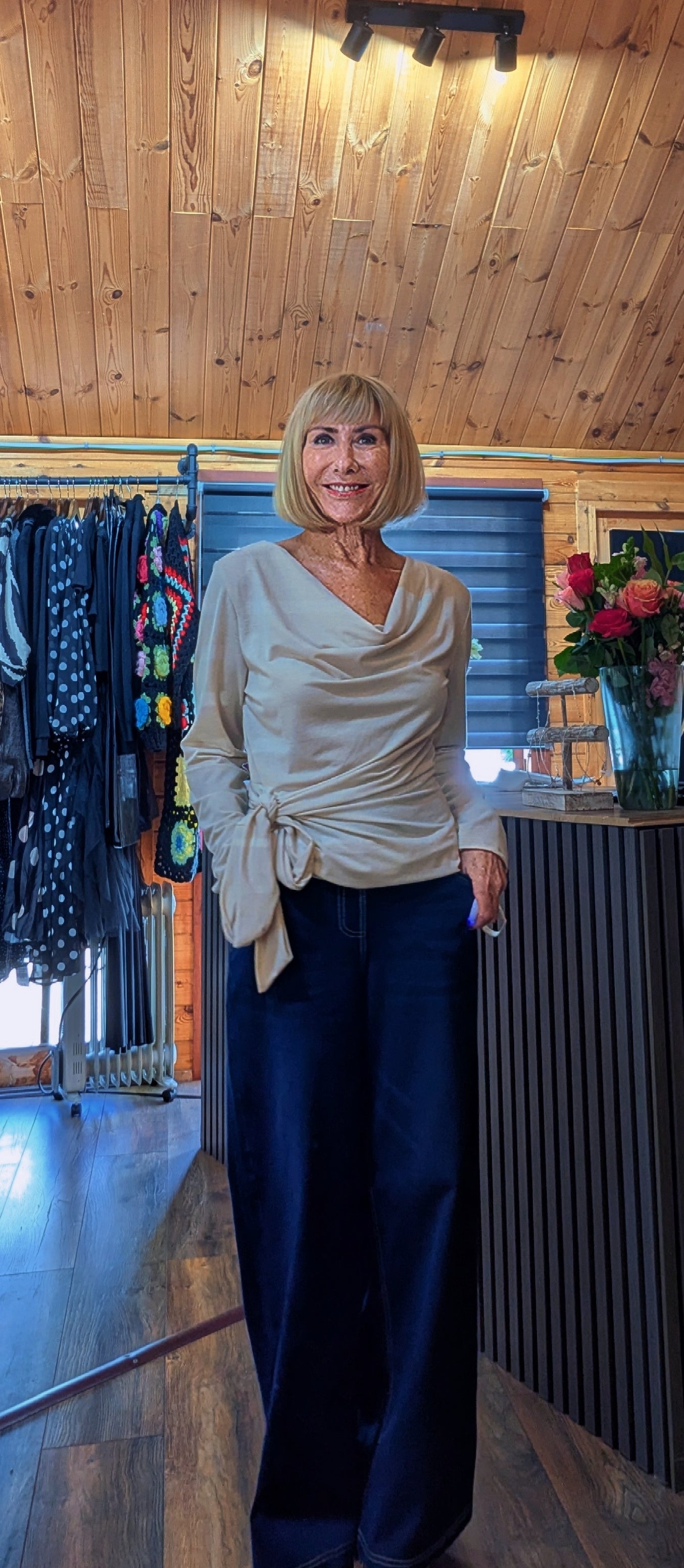 Women’s beige draped long sleeve top with side fastening