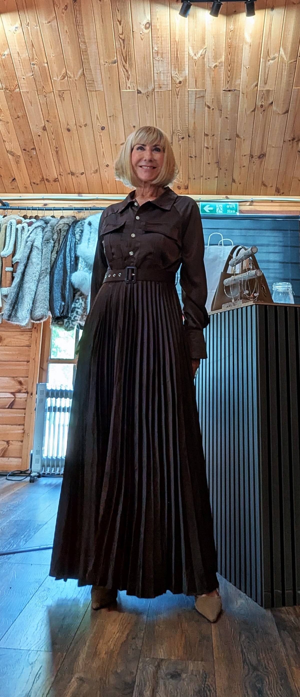 Front view of the Meryl brown shirt dress with chest pockets and belted waist
