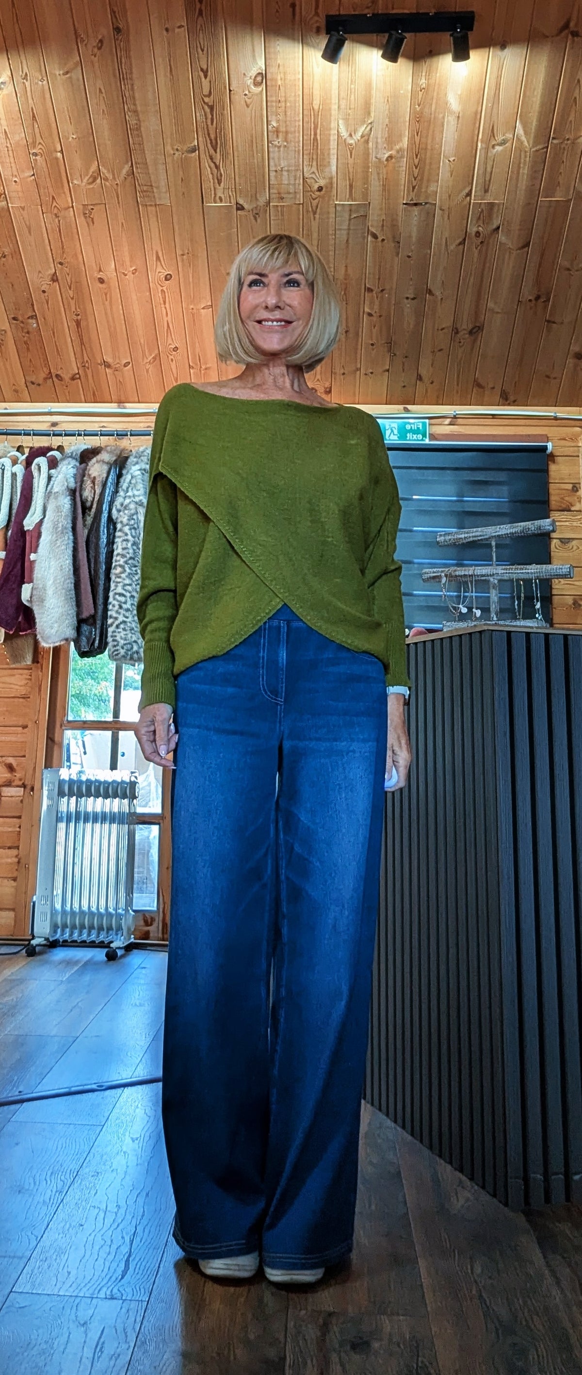 ditydi wearing the olive green Pippa off-the-shoulder jumper