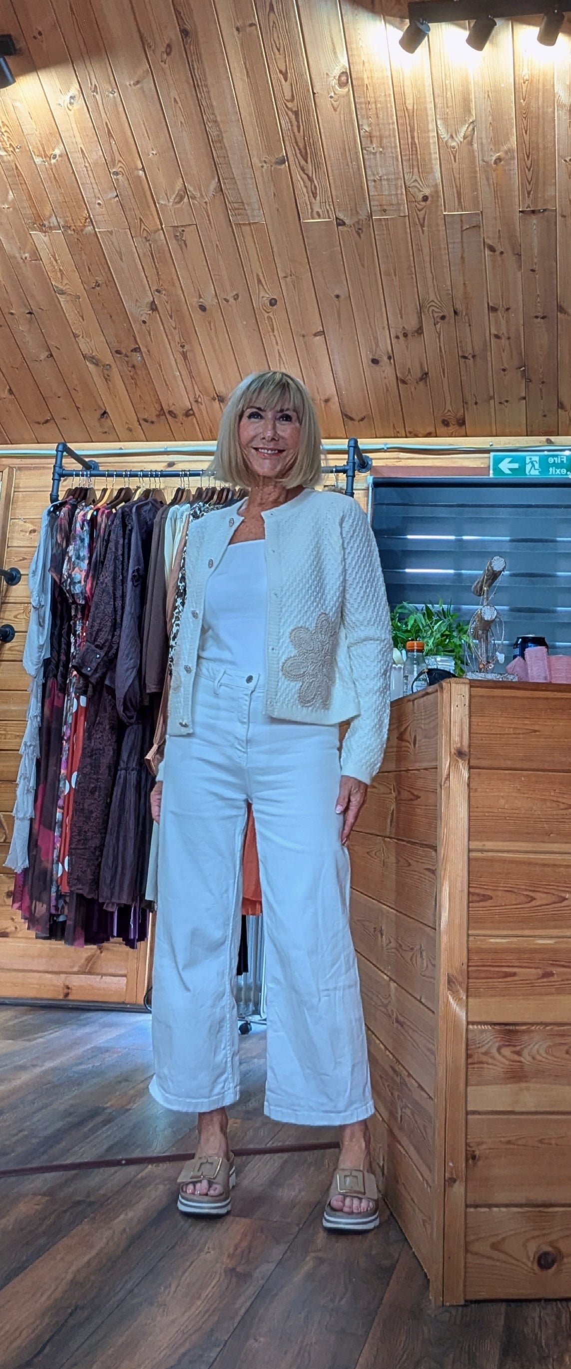 Aviary one size cardigan in soft ivory with statement floral appliqué.
