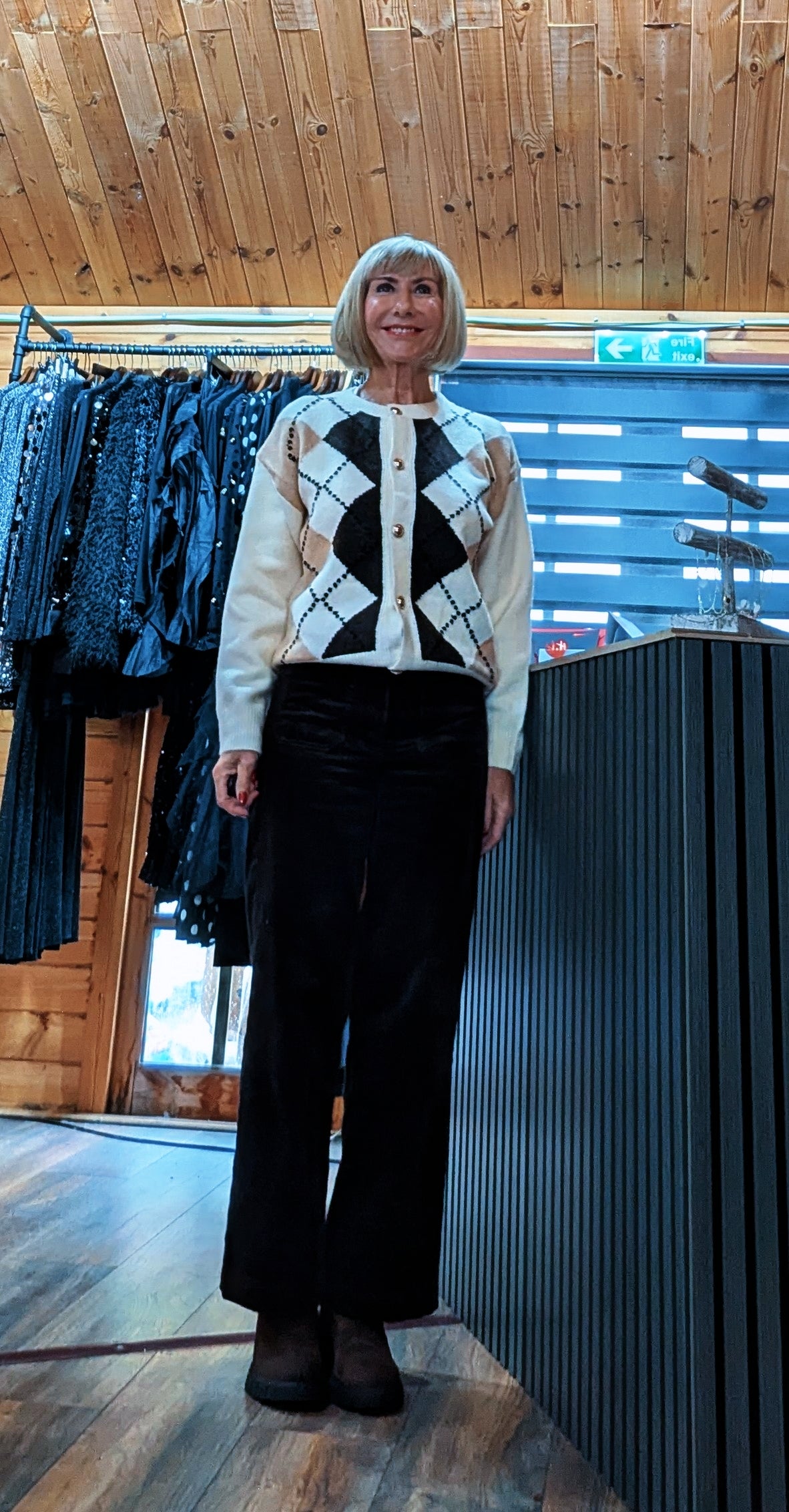 Front view of Di modelling the Irene ivory argyle button-front cardigan