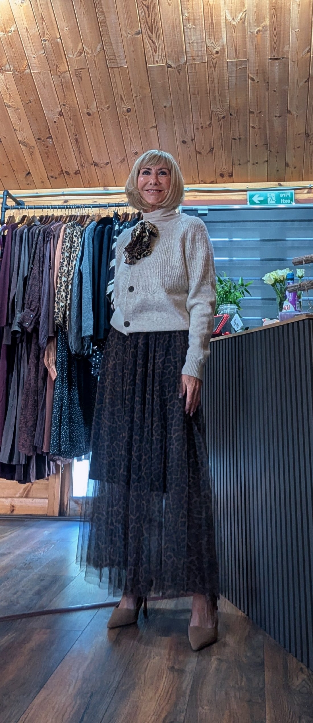 Georgina soft neutral cardigan with button front and animal print tie worn with a maxi tulle skirt