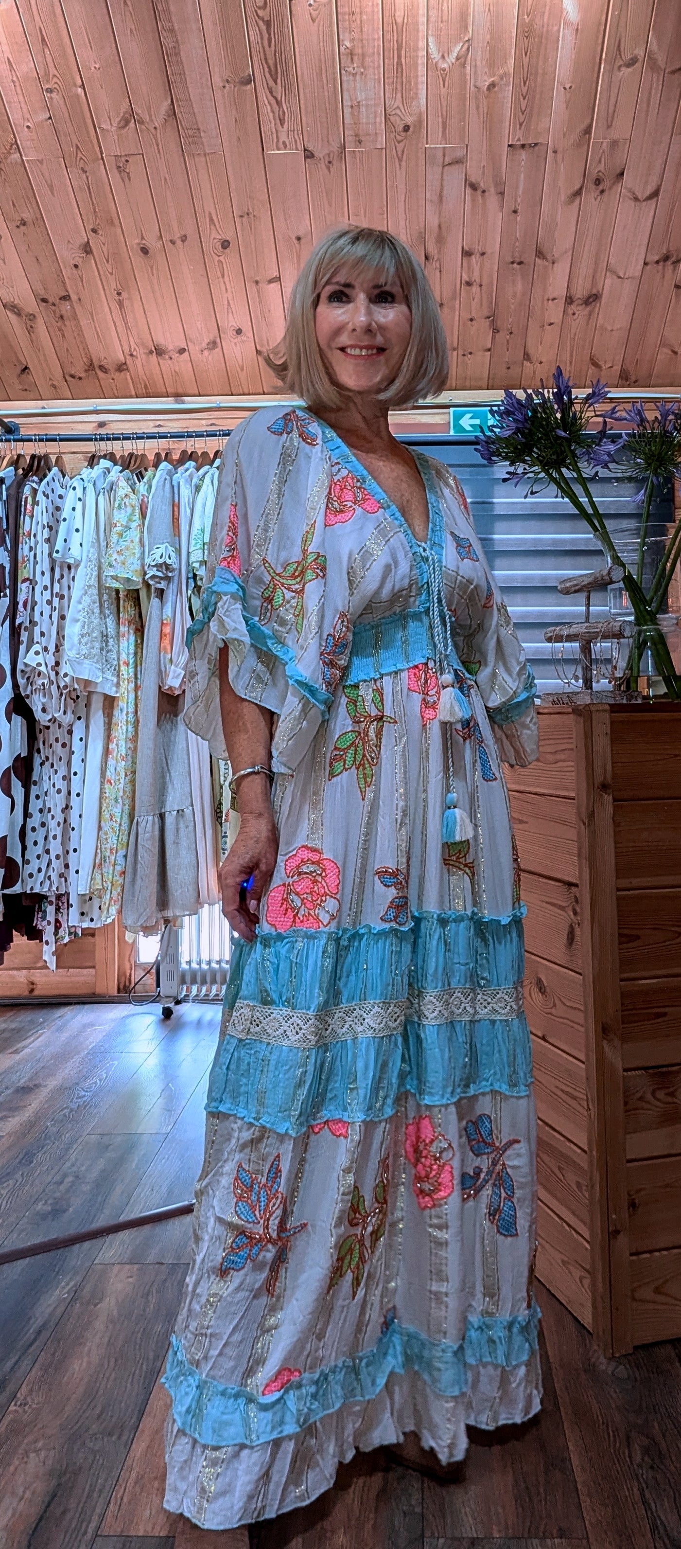 Lucy long floral summer dress featuring turquoise borders and delicate lace trim.