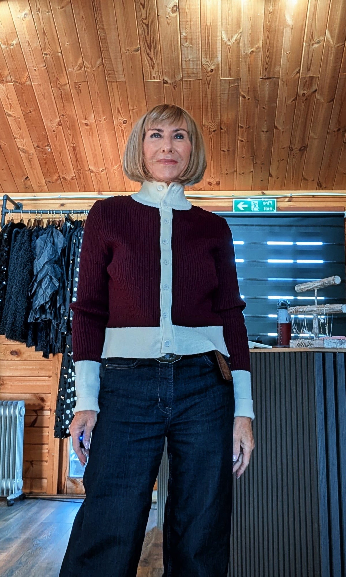 Front view of Mallory cardigan showing the cream high collar, front buttons and contrasting hem