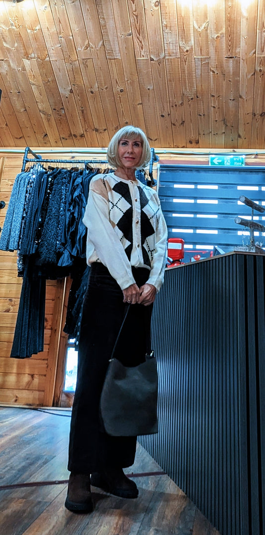 Di wearing the Irene ivory argyle cardigan with black trousers and a black handbag